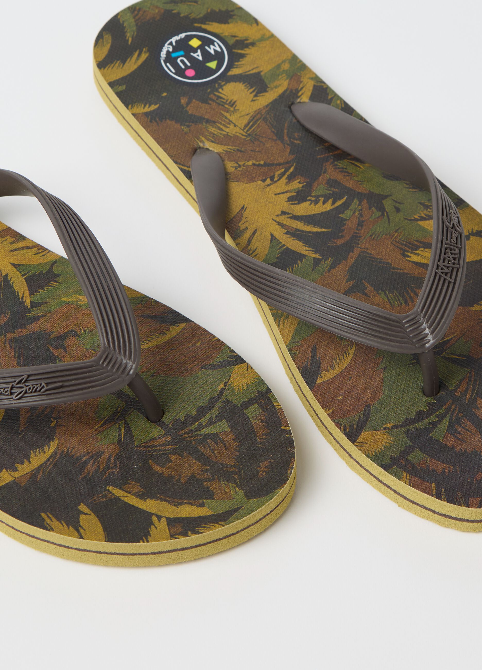 Maui and Sons flip flops with tropical motif