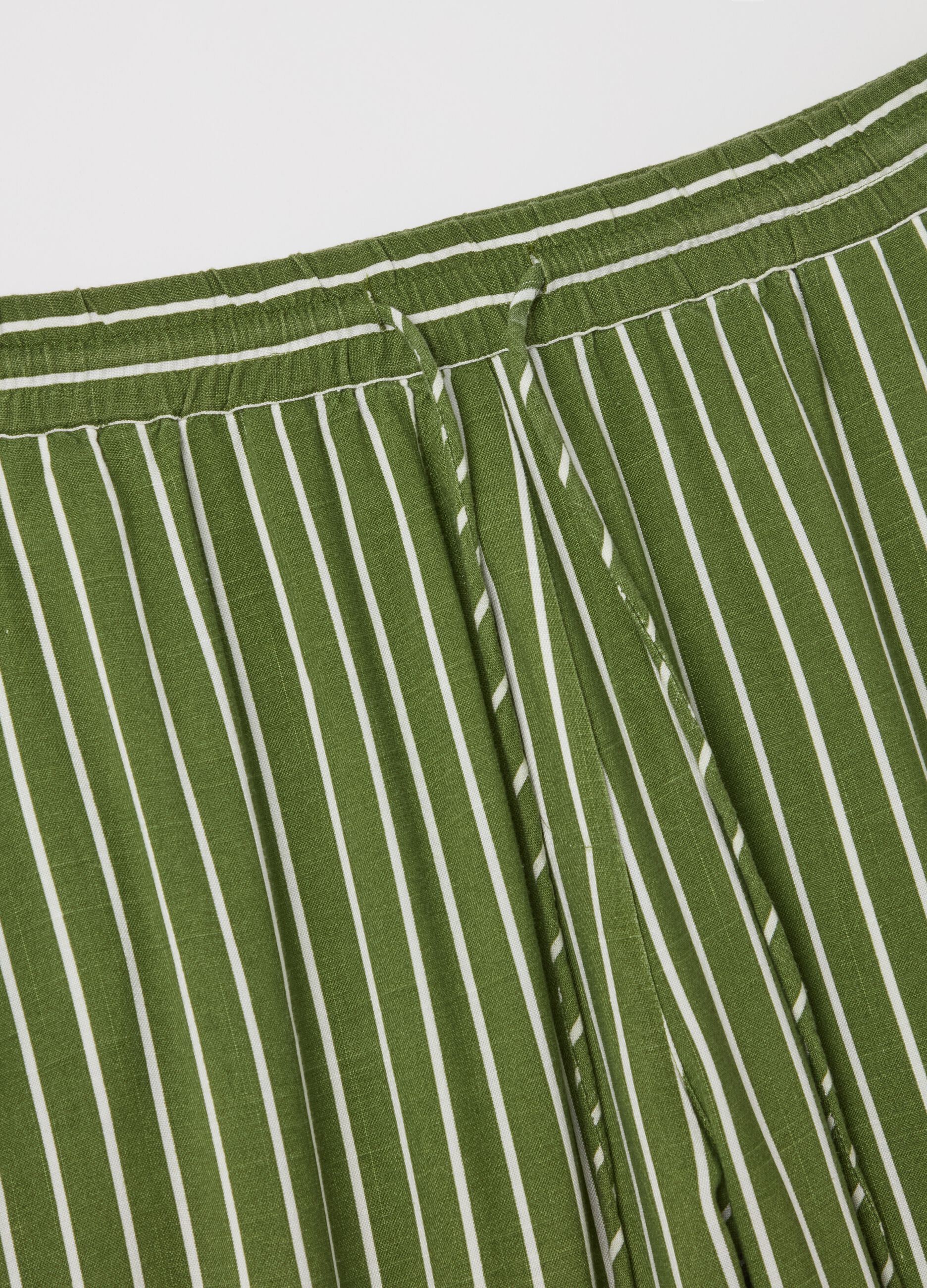 Striped green palazzo trousers in viscose and linen