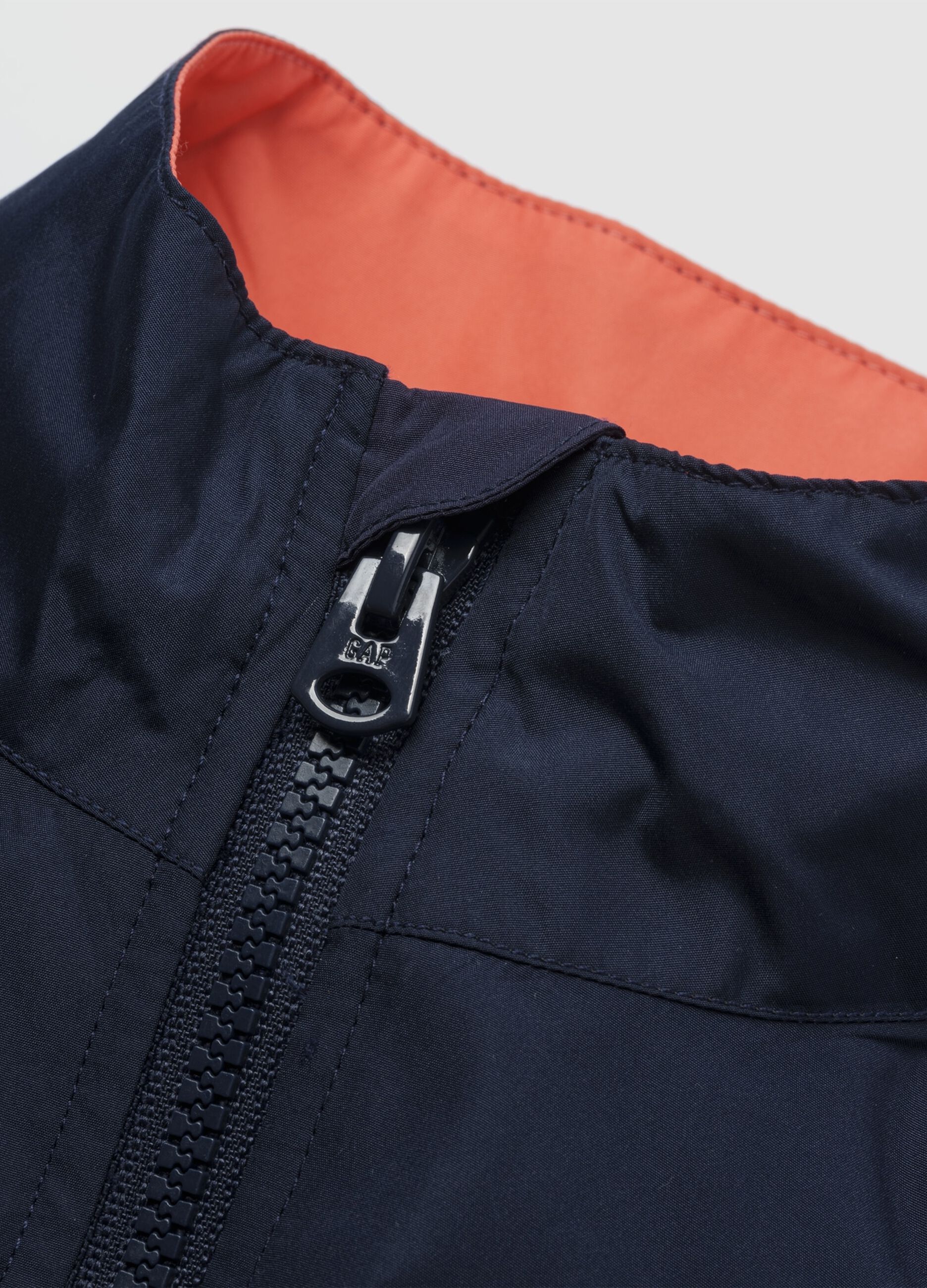 Light blue jacket with orange and grey accents