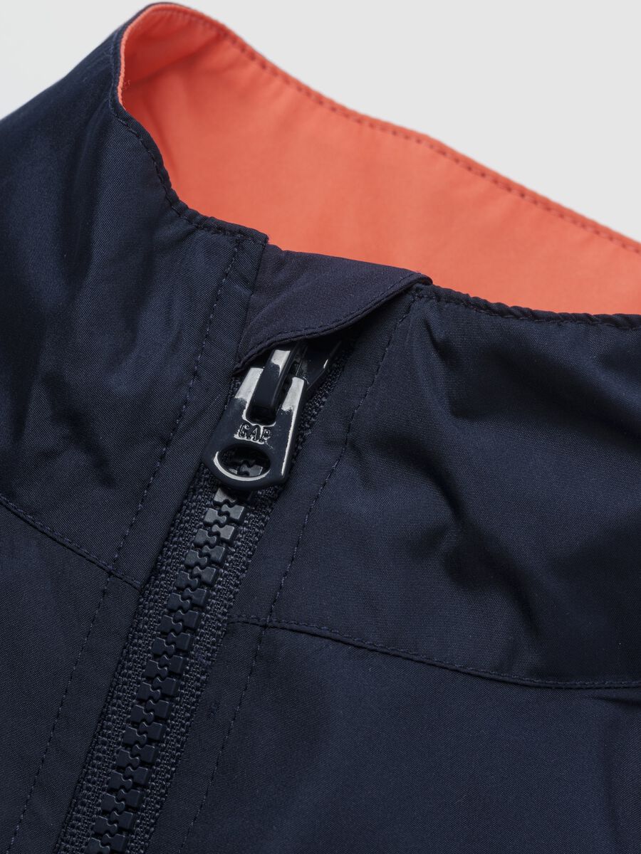 Light blue jacket with orange and grey accents_2