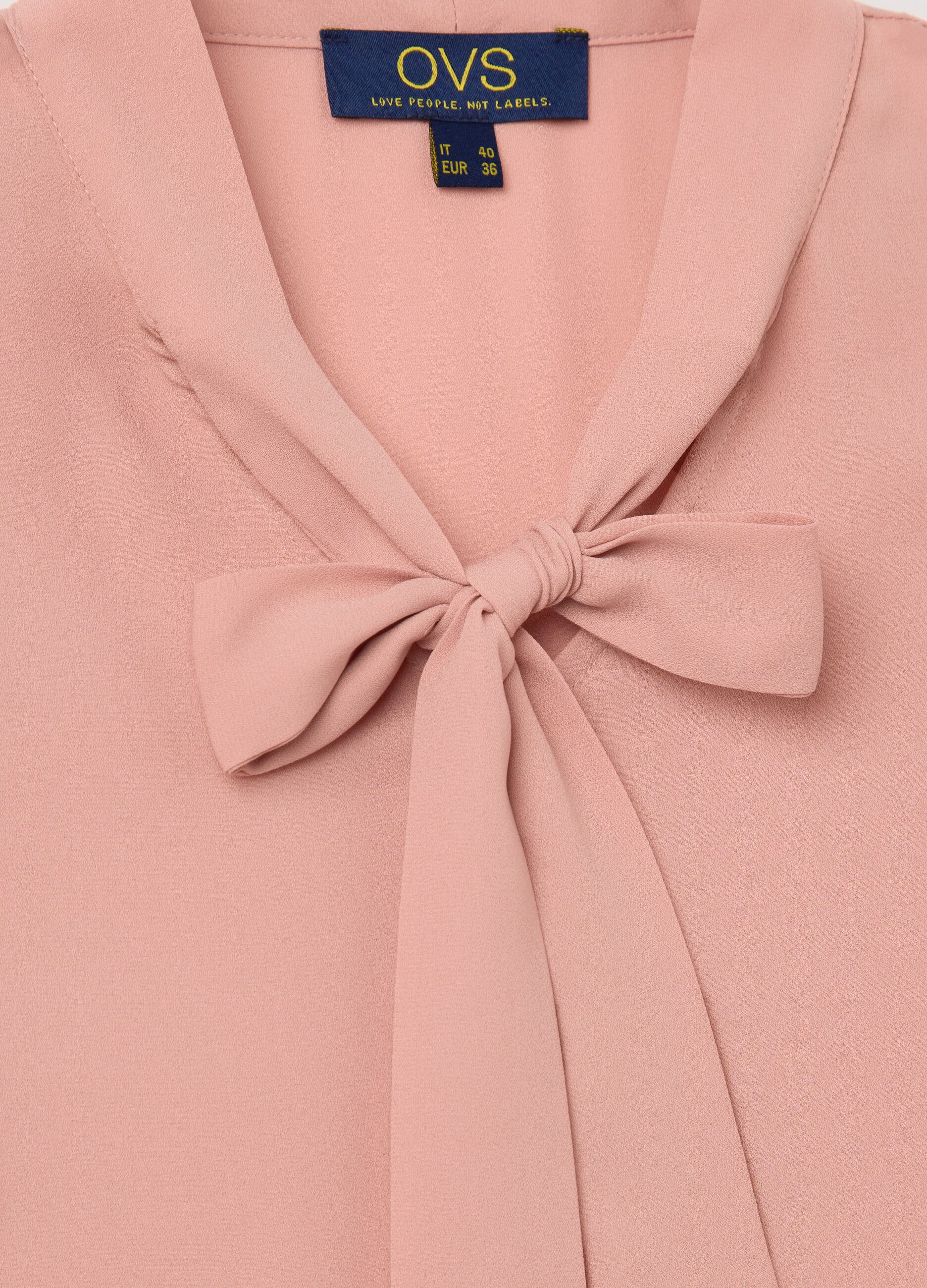 Pink sleeveless blouse with flounce
