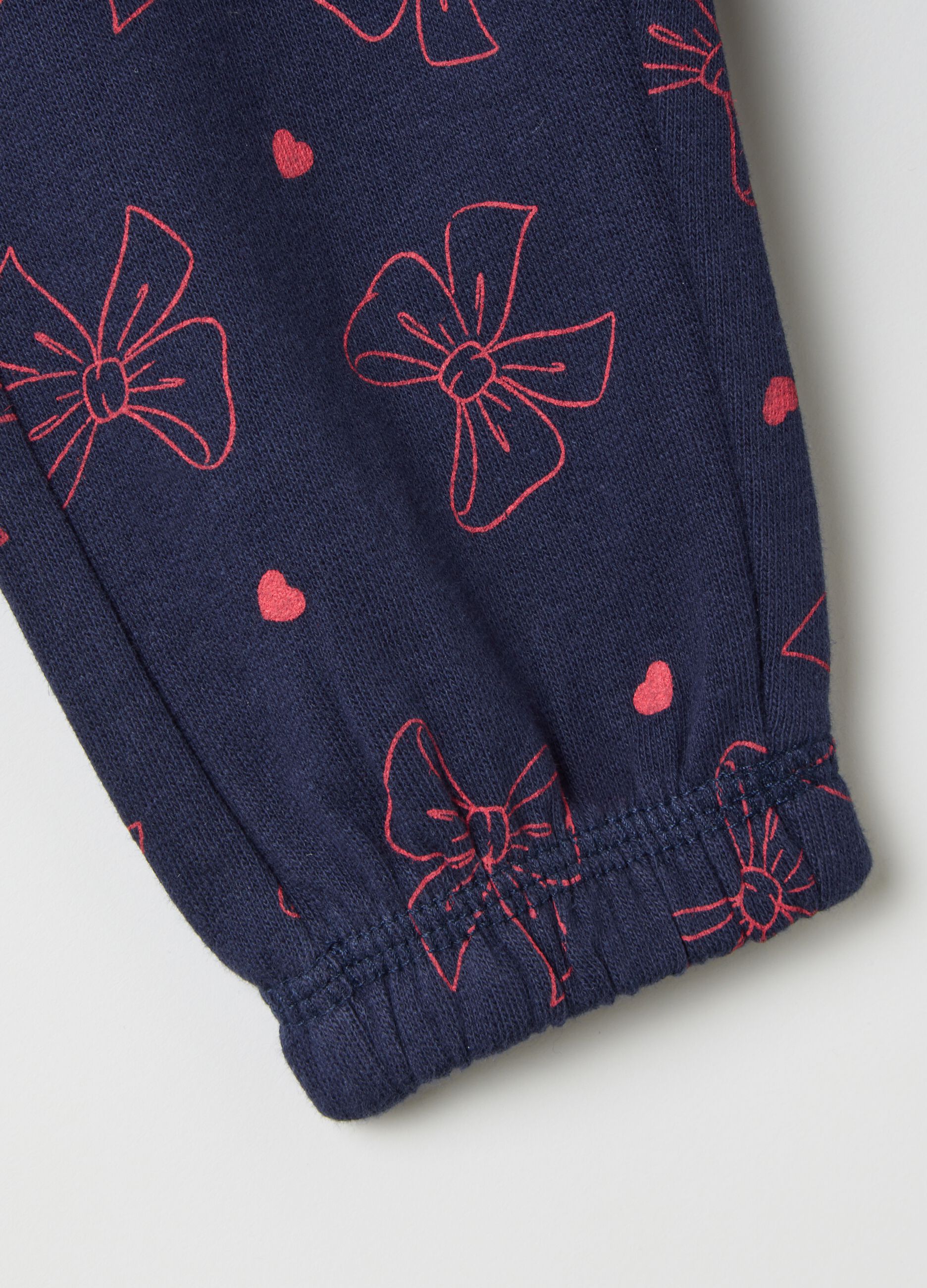 Blue leggings with bows and pink hearts