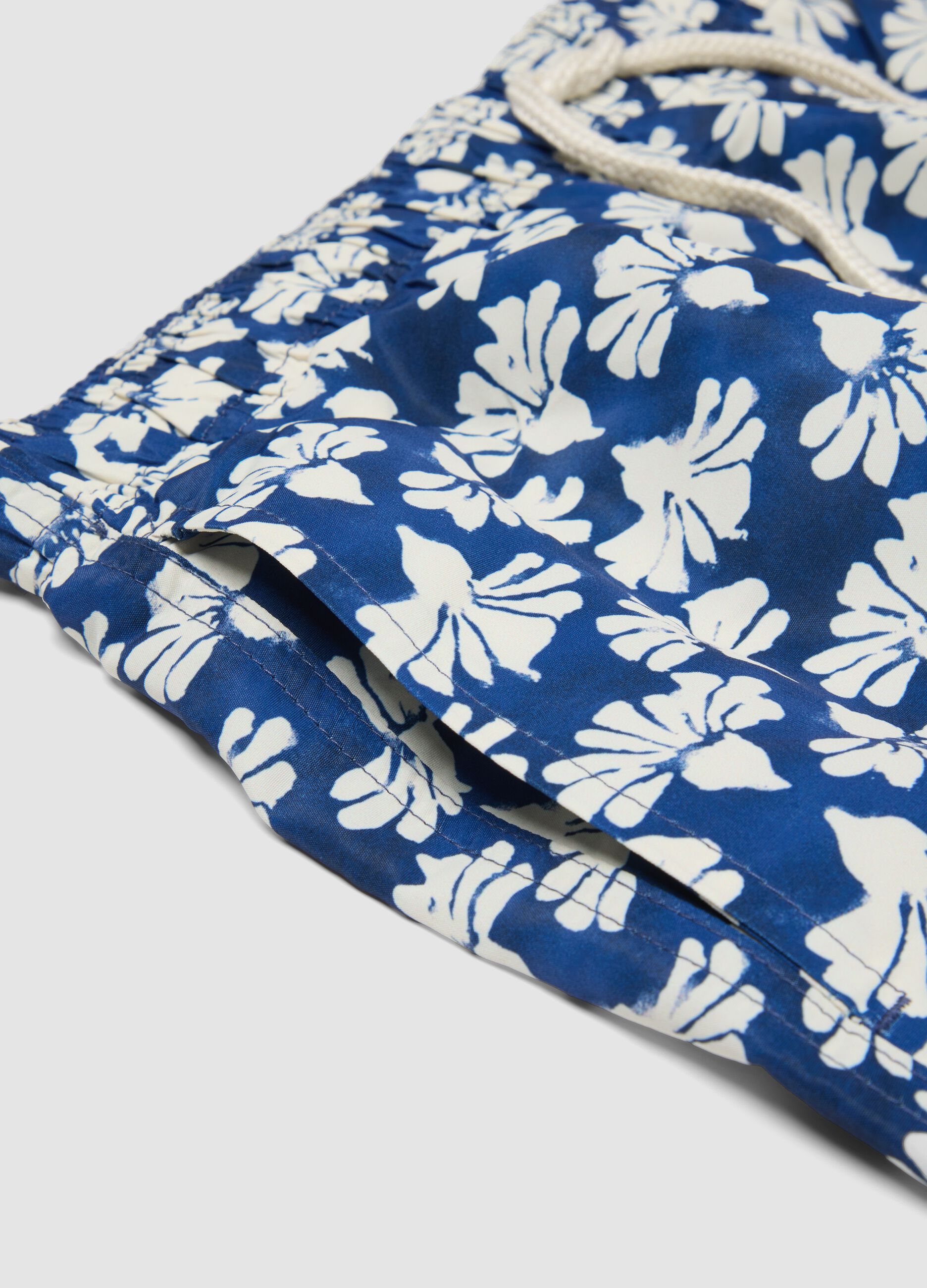 Blue floral-print swim shorts