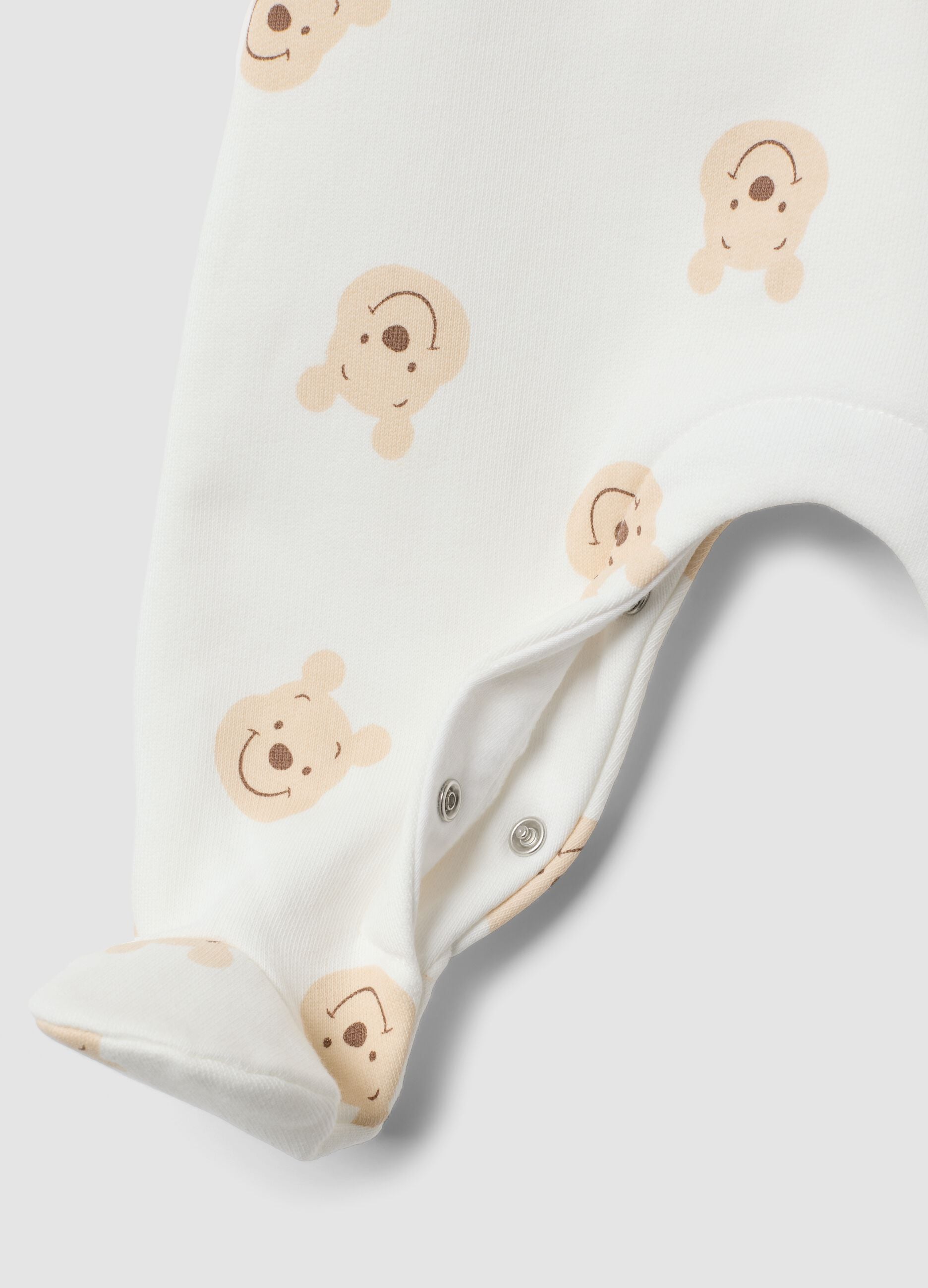 White organic cotton sleepsuit with Winnie the Pooh print