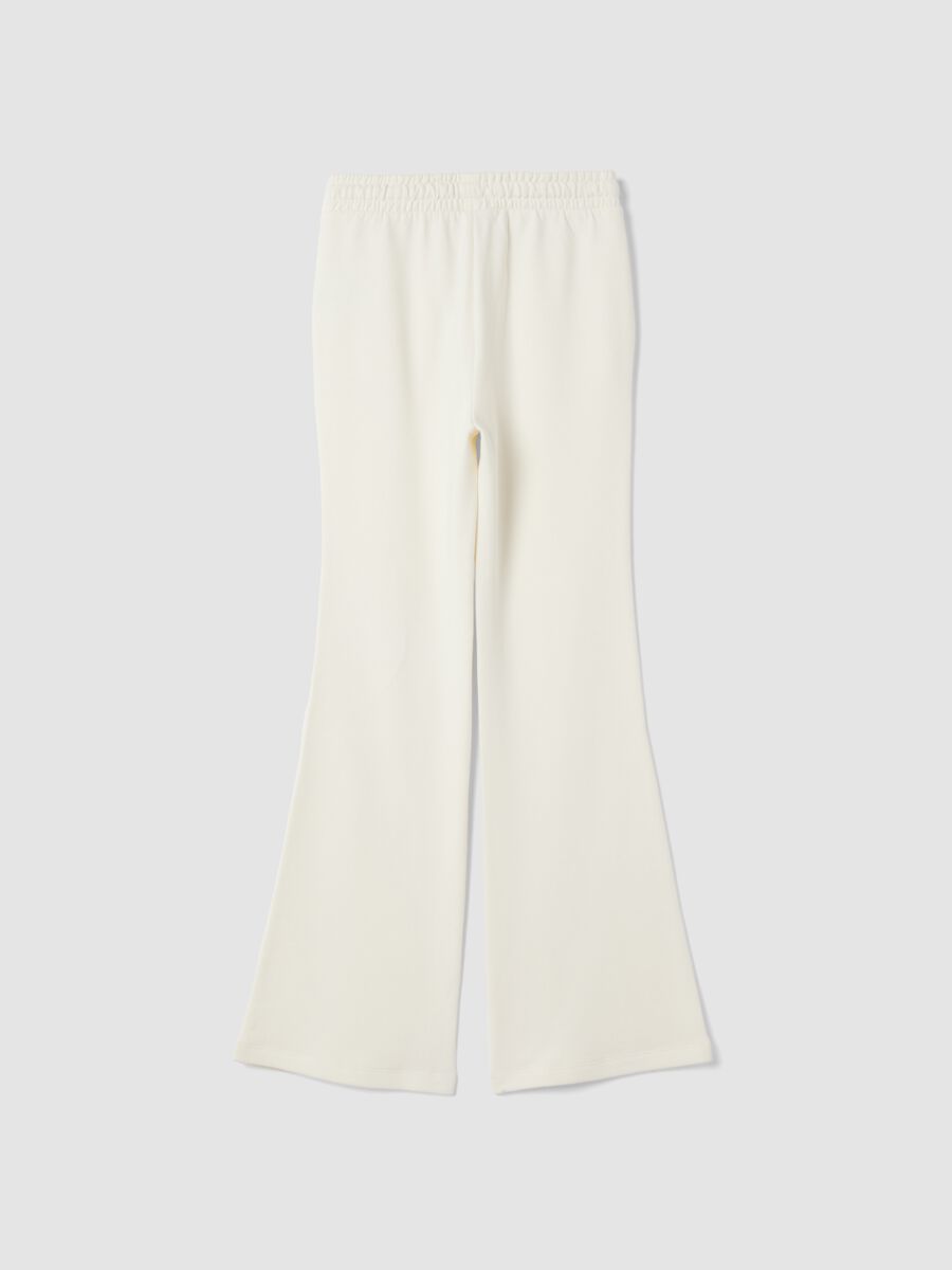 Pantaloni bianchi flare in puro cotone organico_1