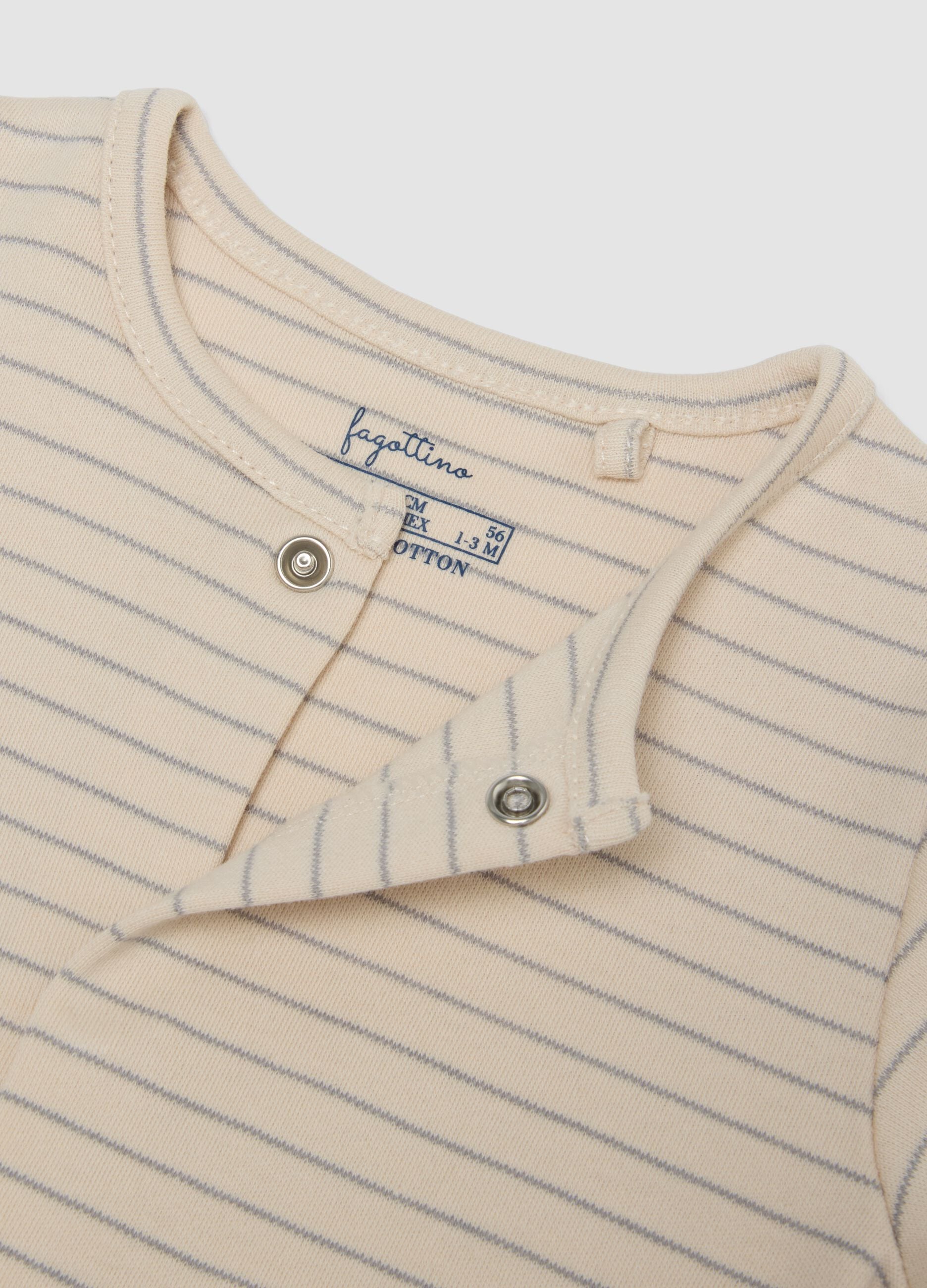 2-pack of organic cotton baby sleepsuits with feet in beige and white