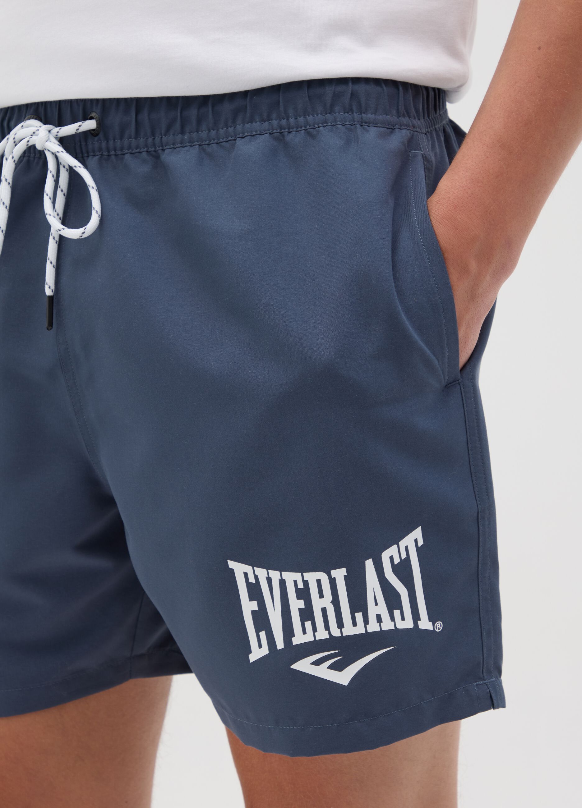 Blue swimming trunks with logo print