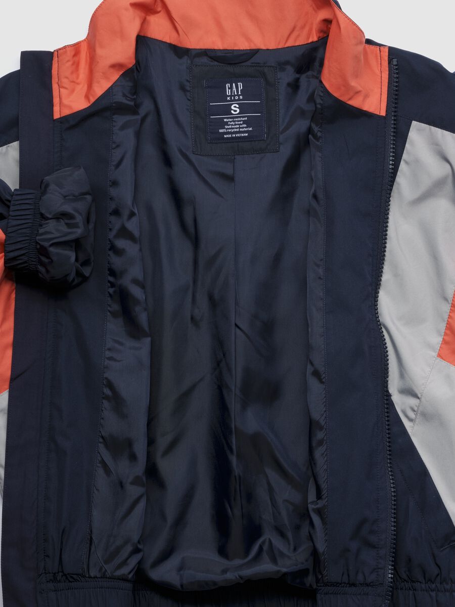 Light blue jacket with orange and grey accents_1