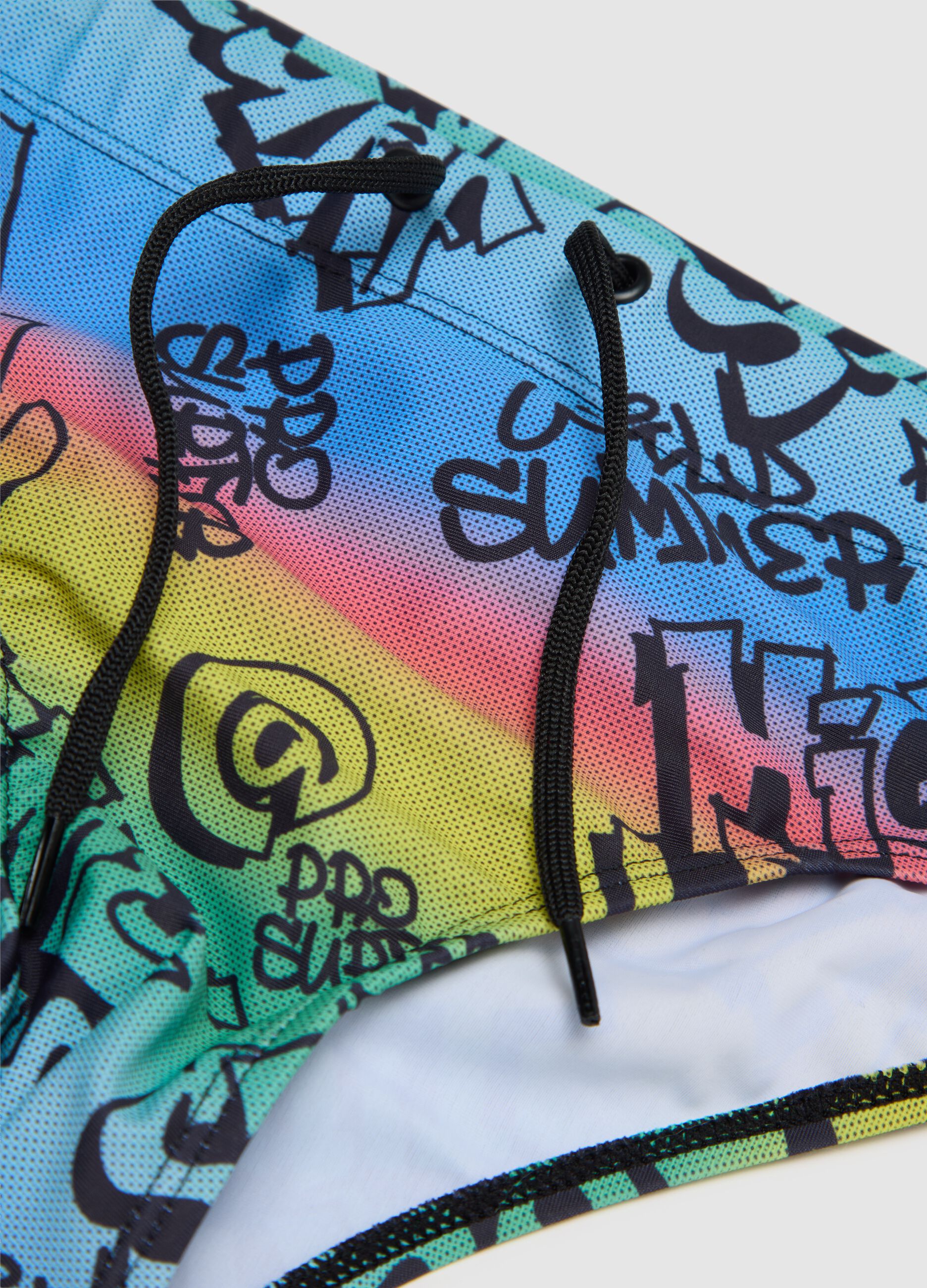 Boys’ swim briefs in multicoloured stretch fabric