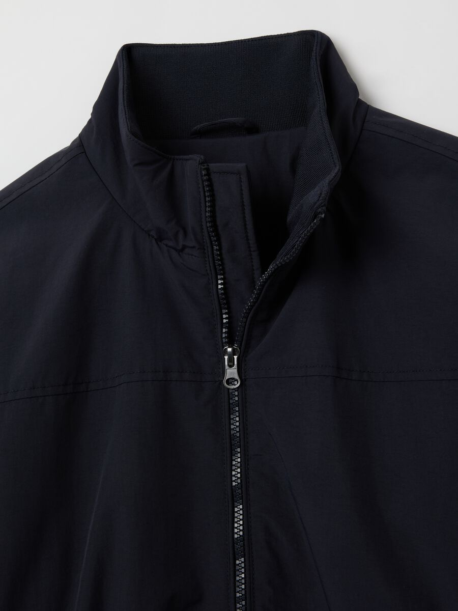 Giacca blu imbottita con chiusura a zip_1