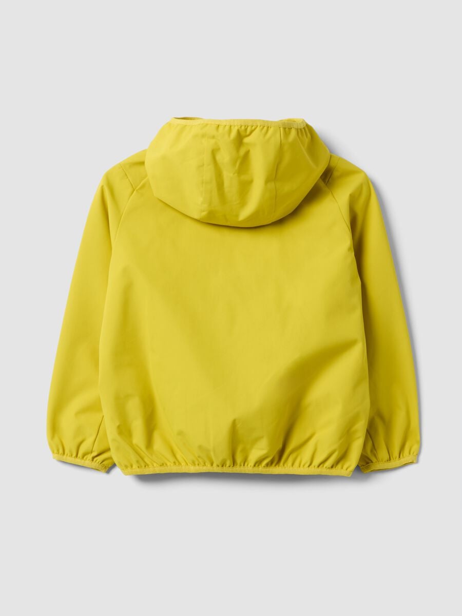 Giacca antipioggia gialla con cappuccio e zip over fit per bambino_1