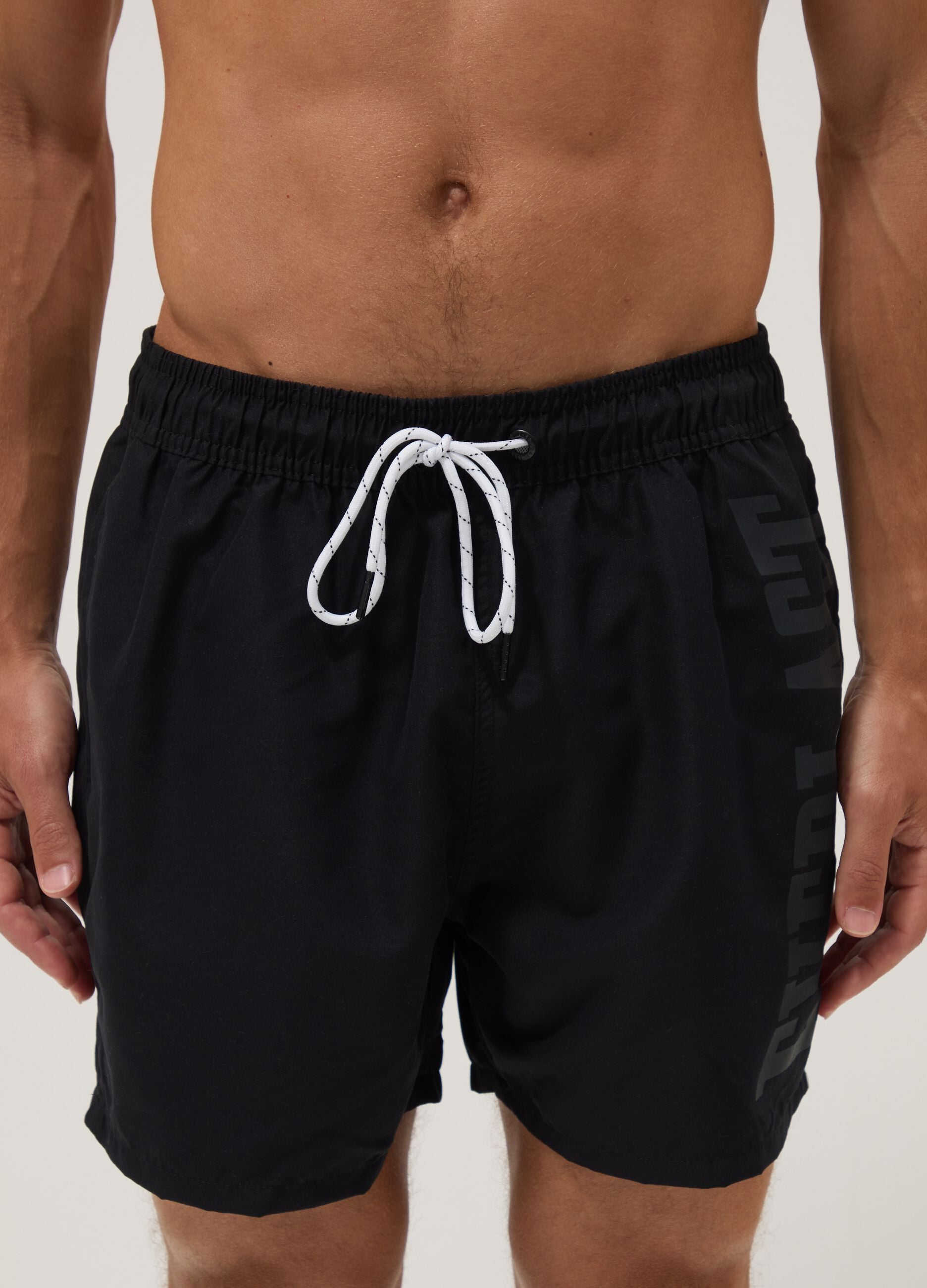 Black swim shorts with drawstring waist