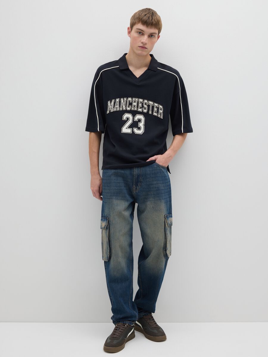 Polo sportiva in puro cotone nero vestibilità oversize_1