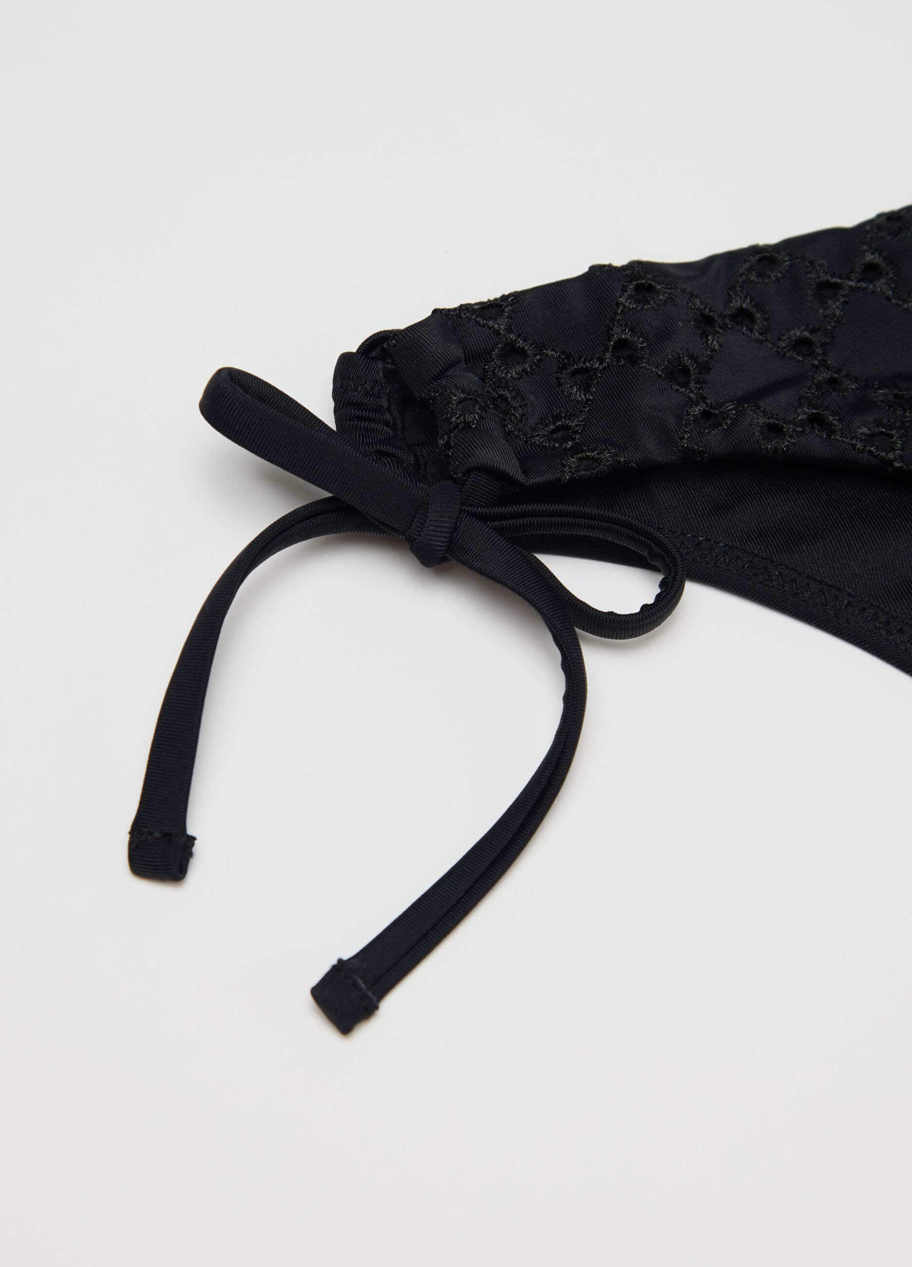 Women’s bikini briefs in black stretch fabric with floral embroidery