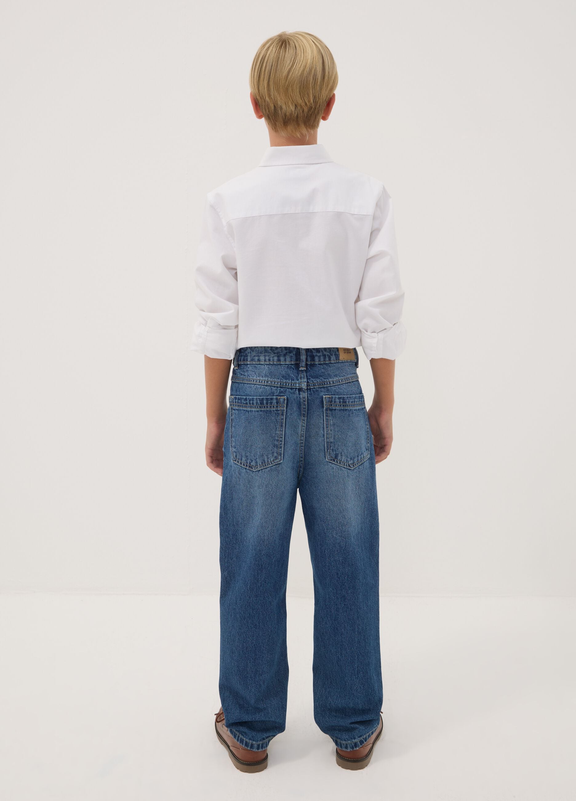 Jeans blu baggy in puro cotone con strappi per ragazzo
