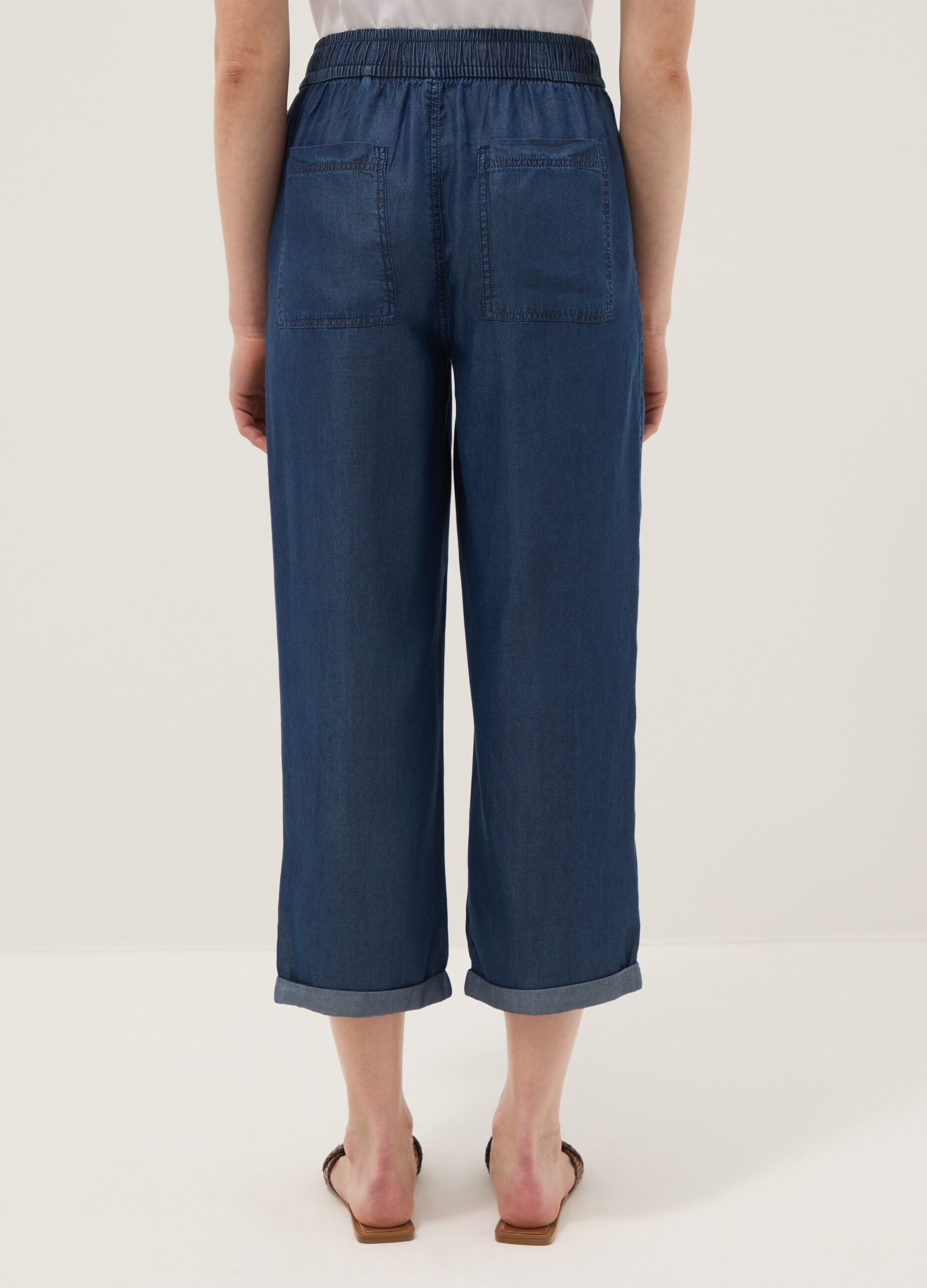 Blue denim jeans in 100% lyocell with elasticated waist, relaxed fit