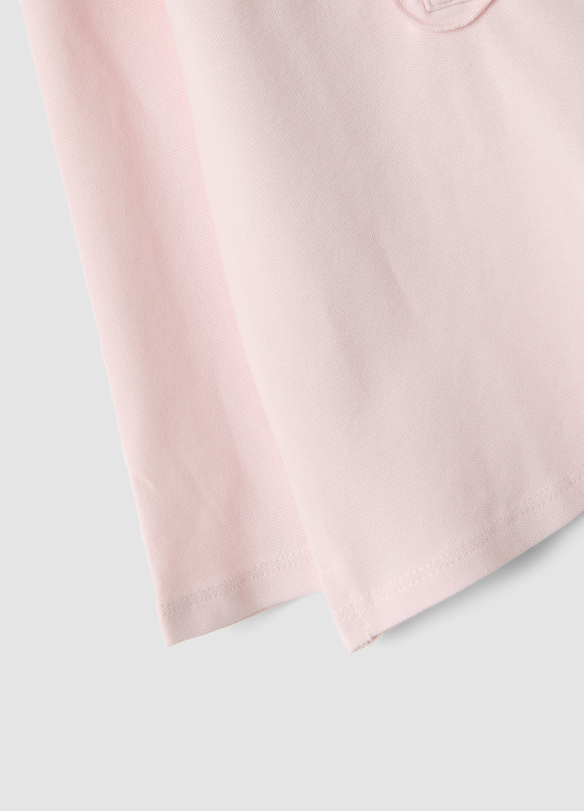 Pink stretch organic cotton polo shirt with ruffle details for baby girl