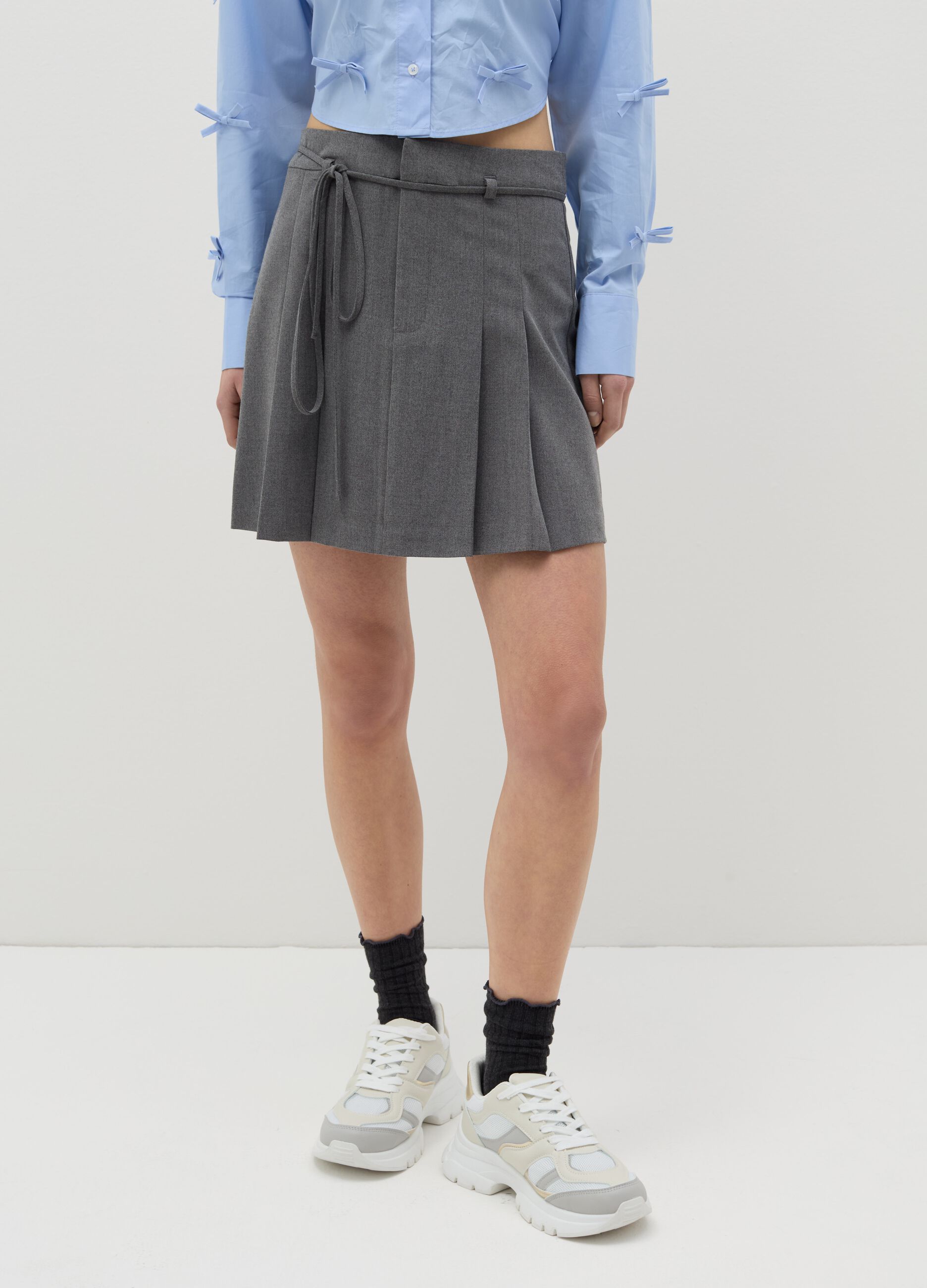 Pleated miniskirt with belt