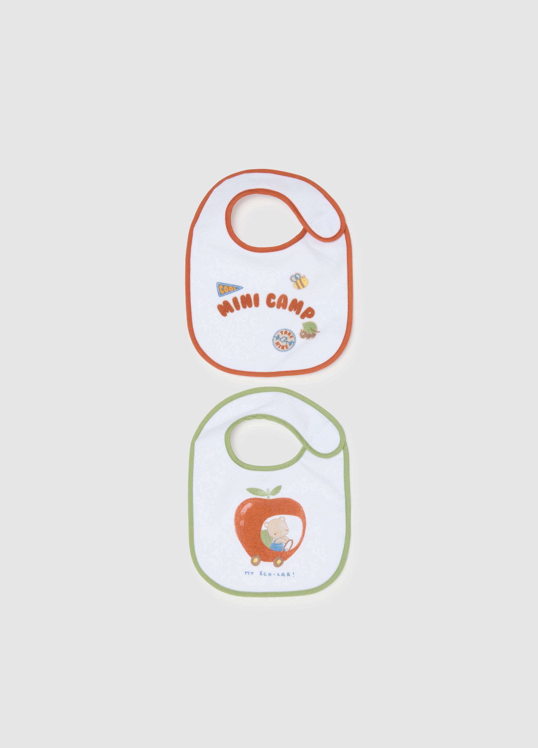 Two-pack white cotton blend bibs with velcro and prints