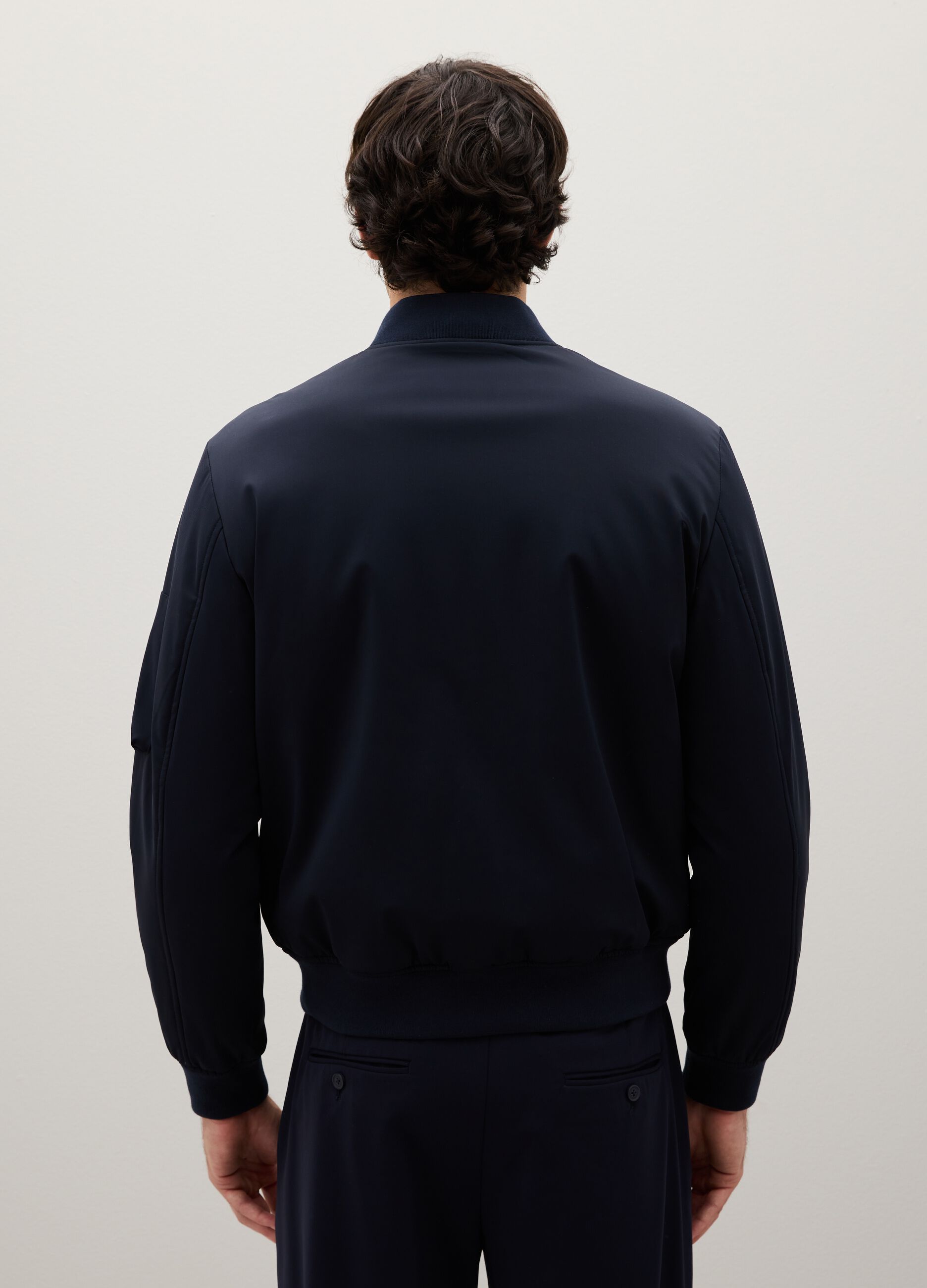 Stretch blue bomber with zip closure