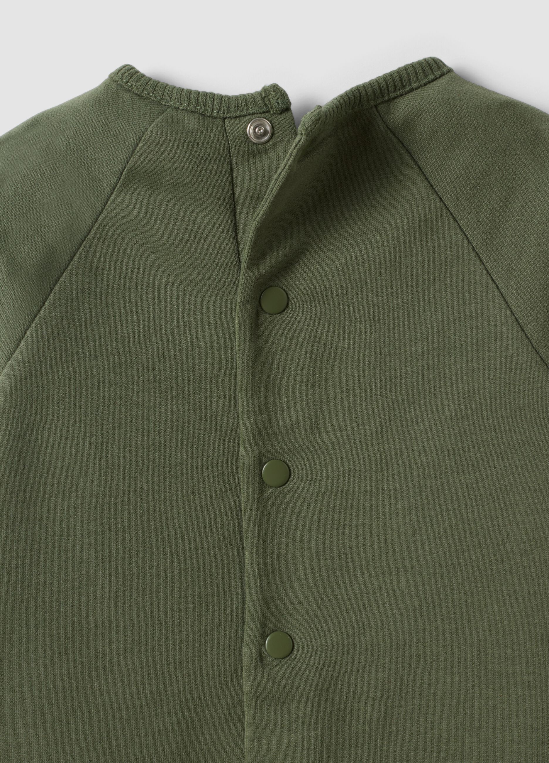 Green long-sleeved organic cotton baby sleepsuit