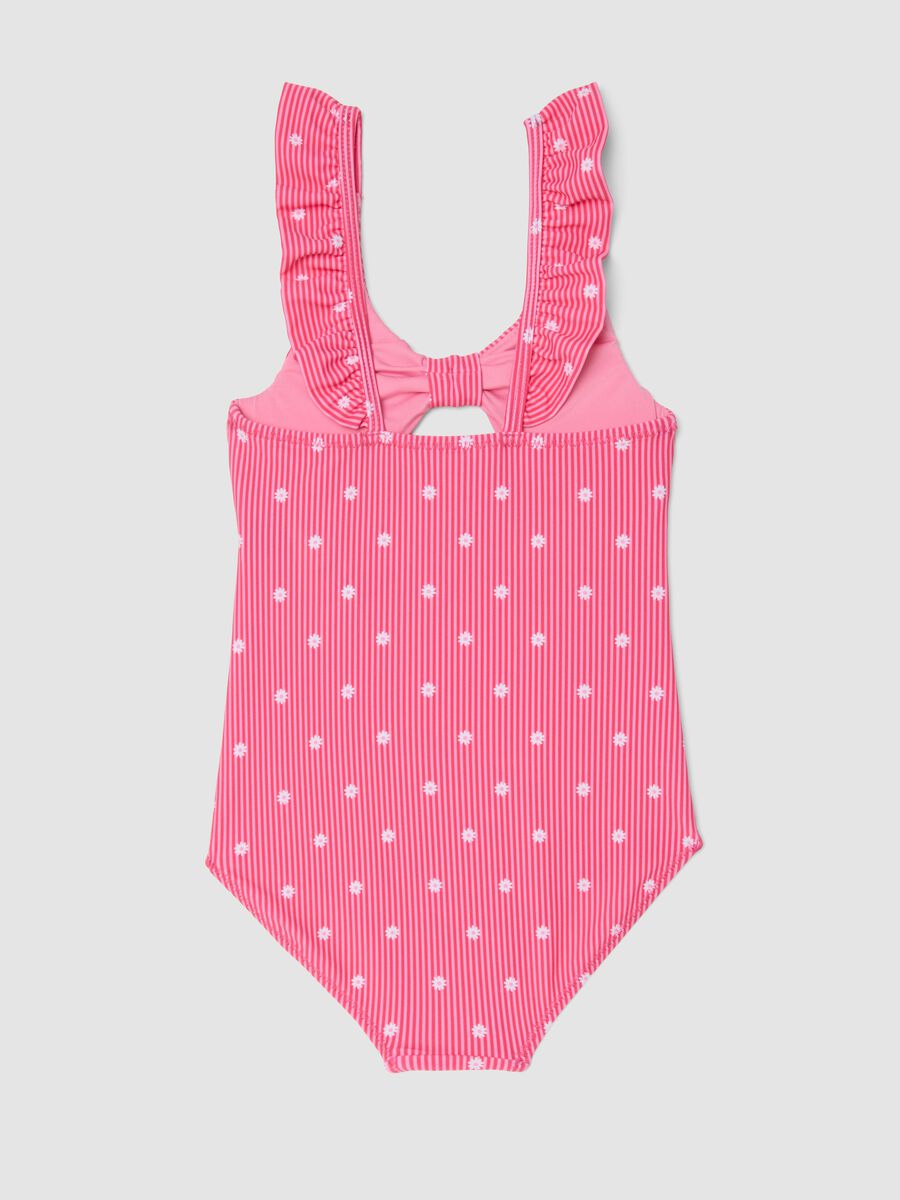 Costume intero rosa in tessuto elasticizzato a righe con volant_1