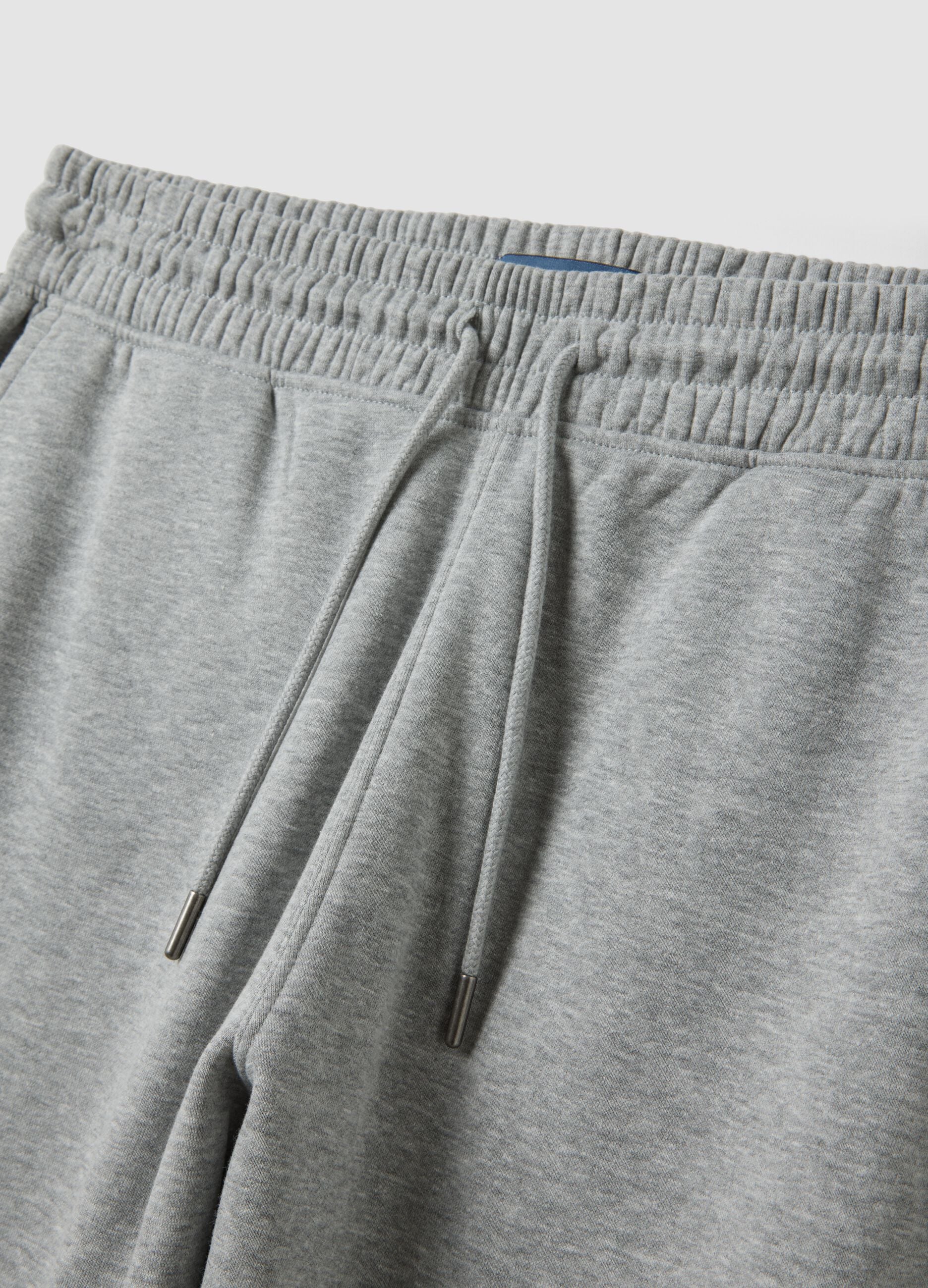 Grey cotton-blend joggers with cuffed hems and drawstring