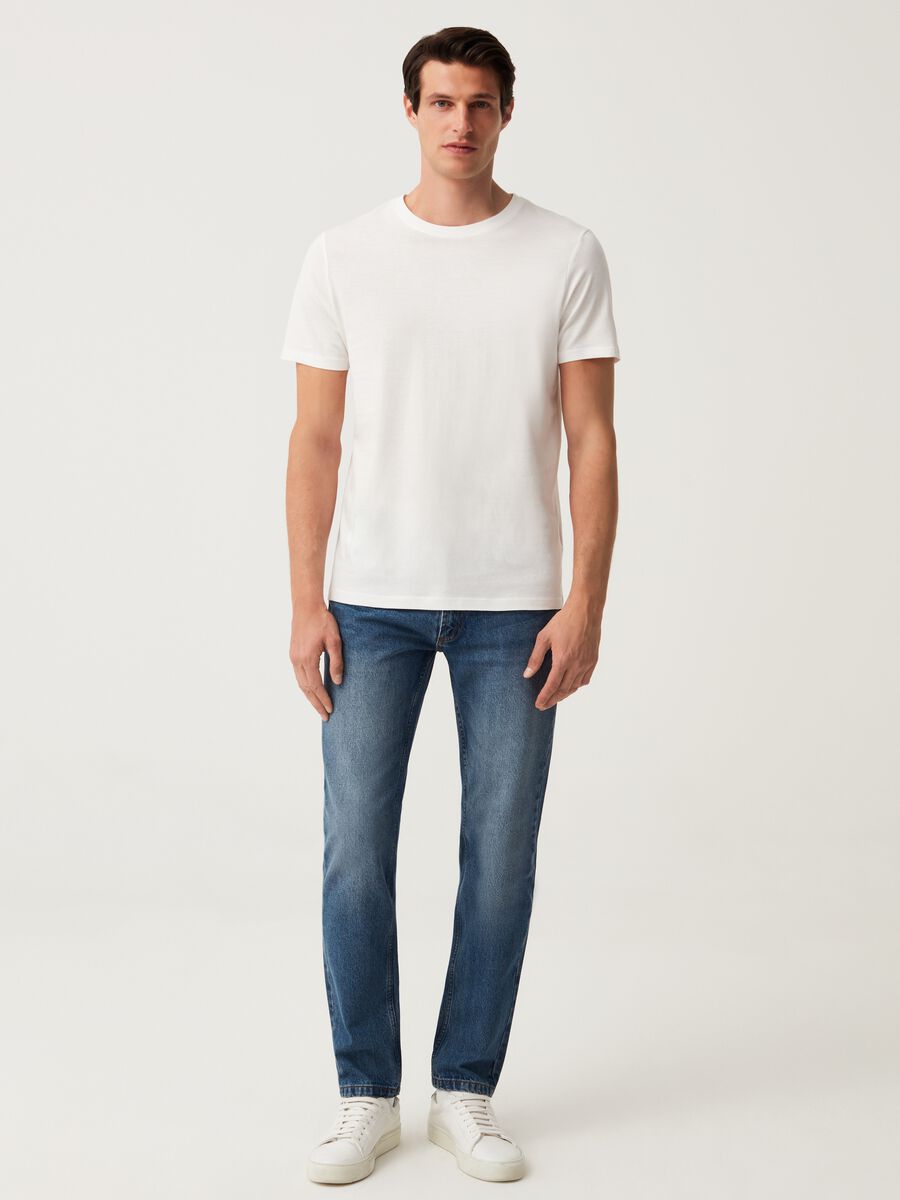 Jeans slim fit con scoloriture_0