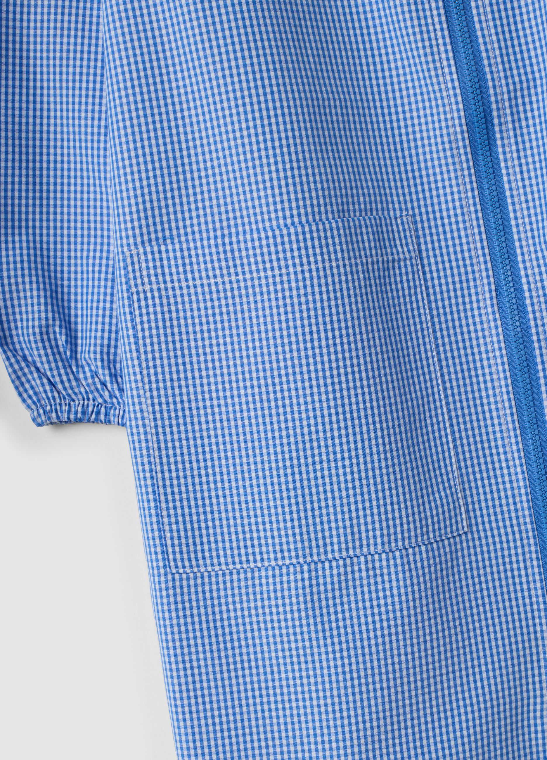 Light blue gingham nursery apron with zip and machine embroidery