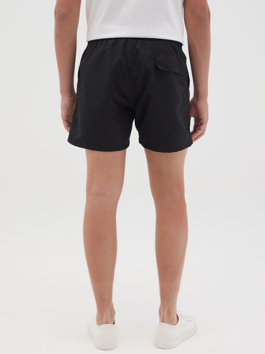 Black swimming trunks with Nirvana logo_3
