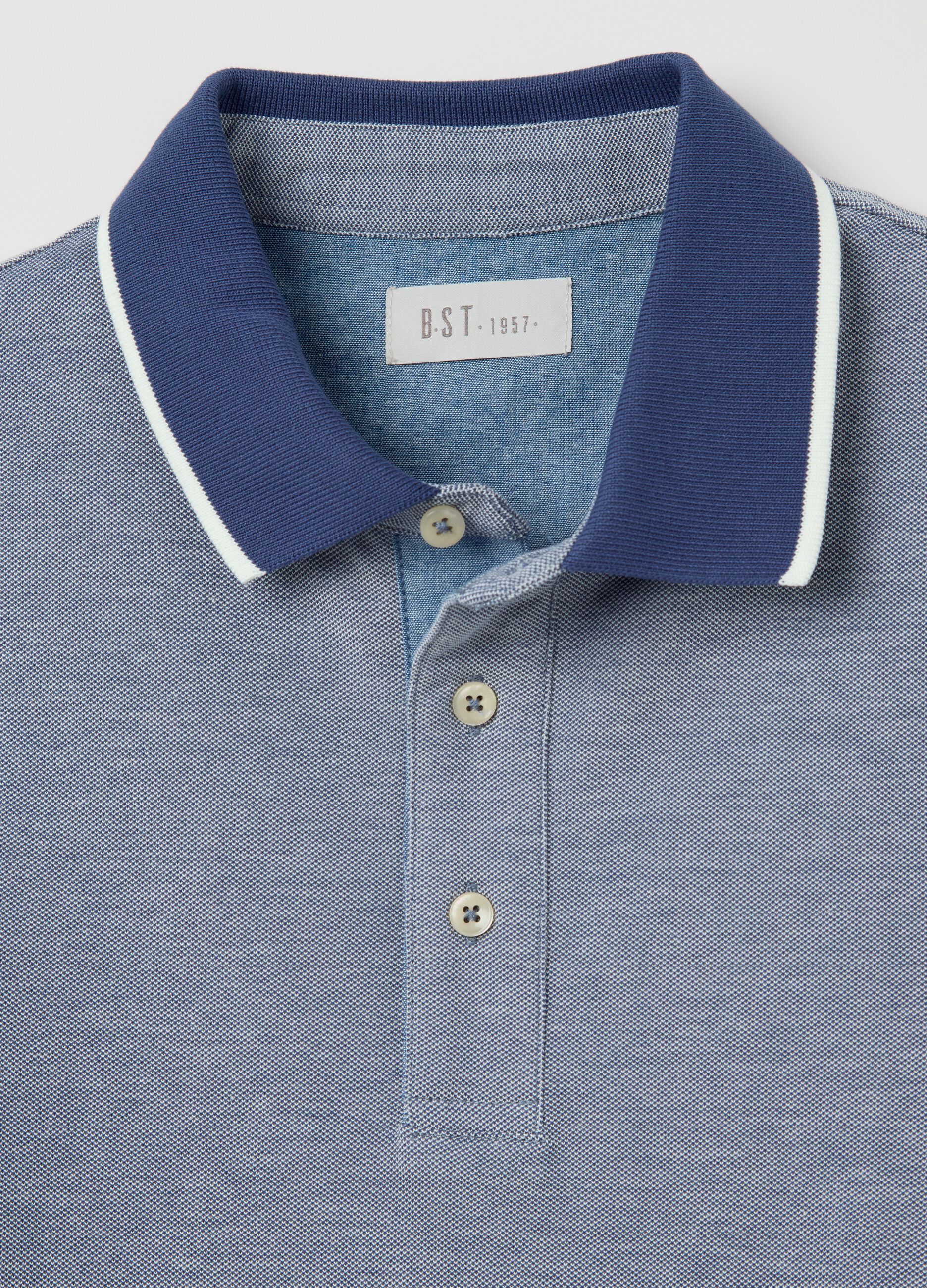 Blue polo shirt with short sleeves in cotton piquet