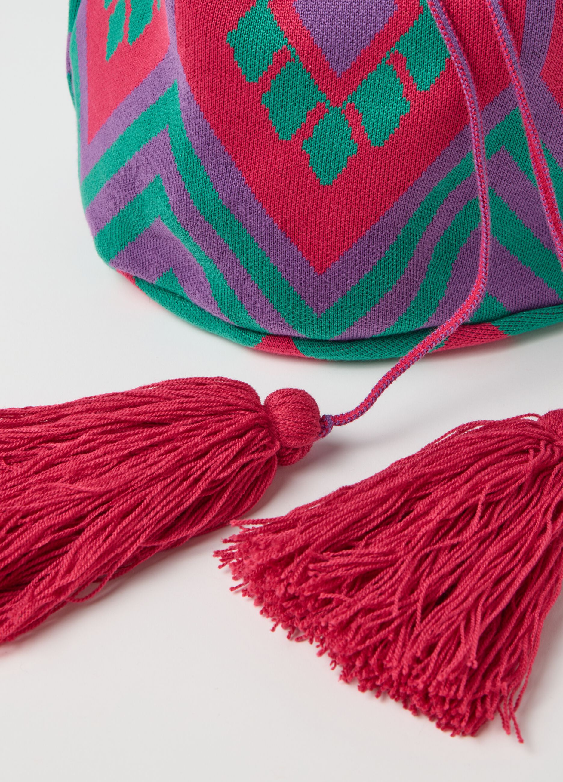 Shoulder bag with geometric motif and tassels