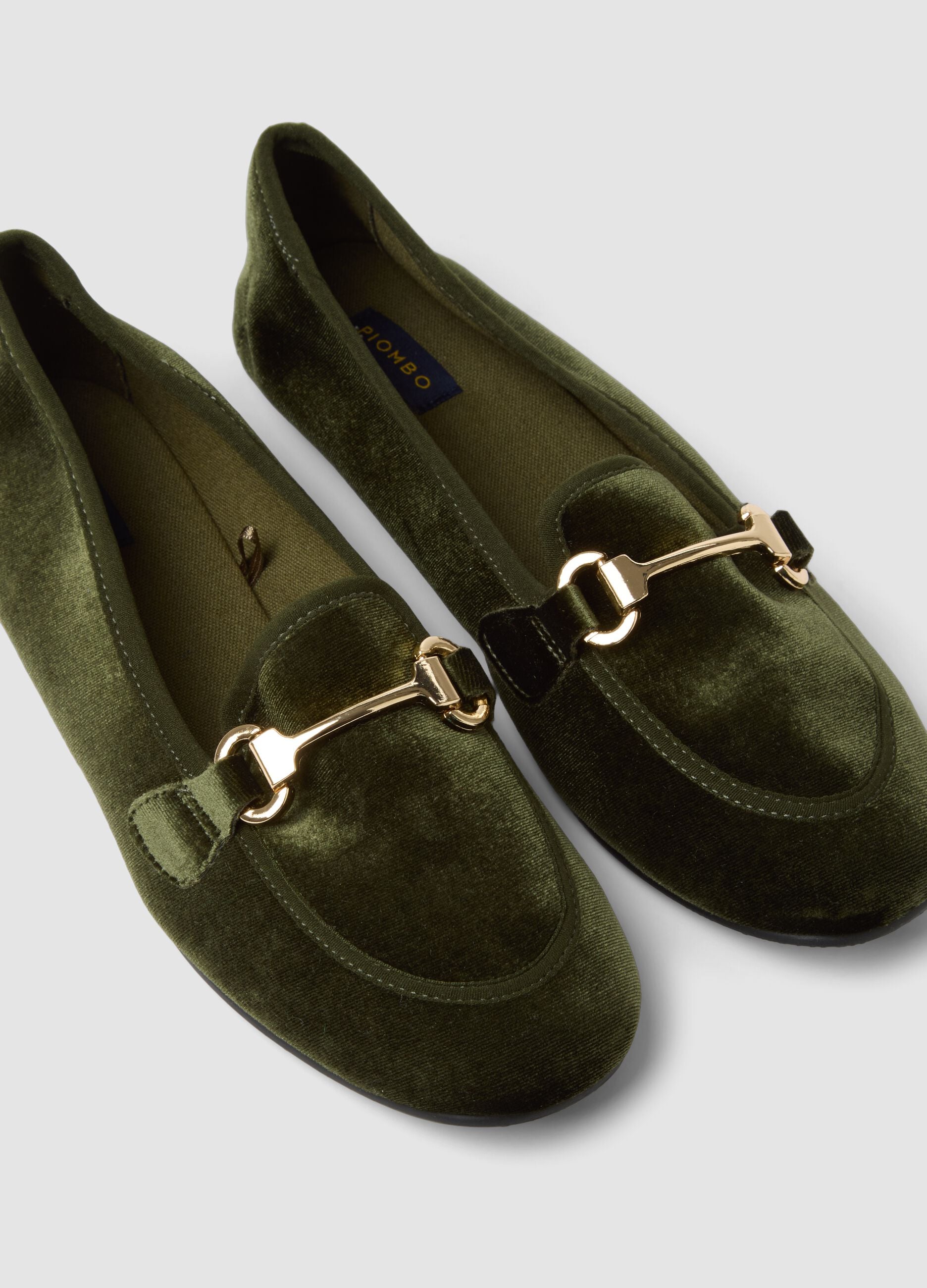 Green loafers with gold-tone bit