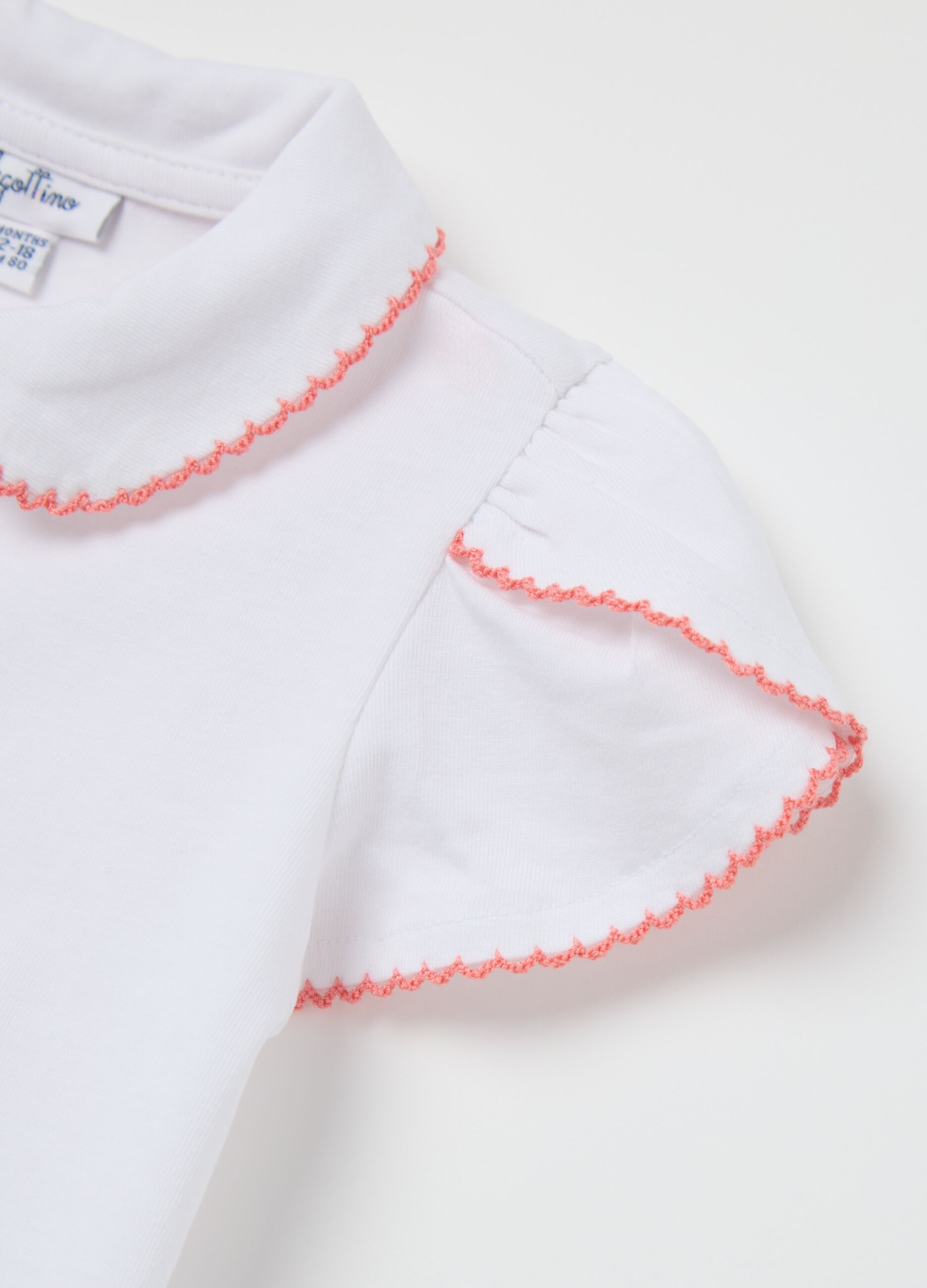 Polo bianca in cotone elasticizzato con volant 