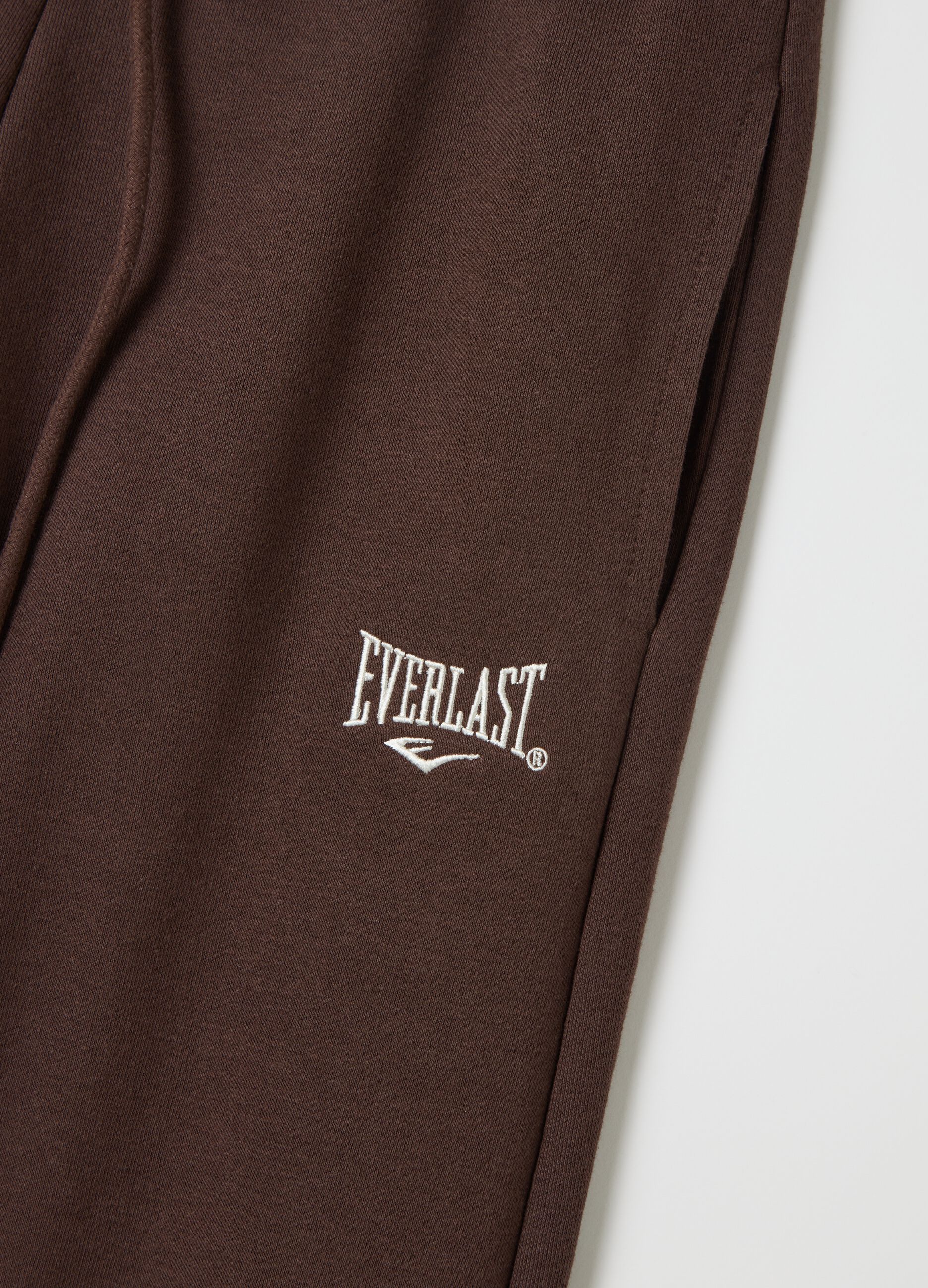 Joggers with contrasting inserts and logo embroidery