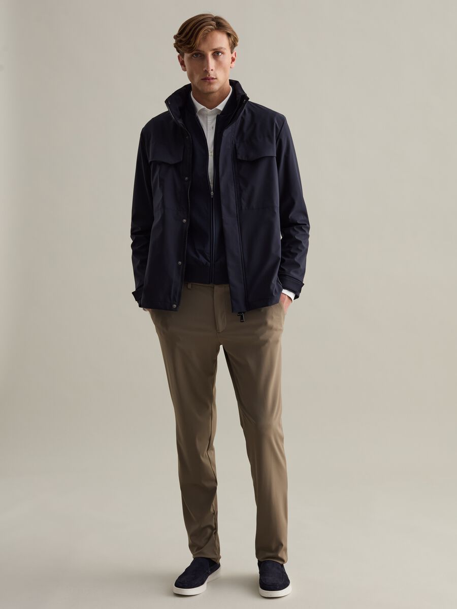 Short jacket in technical fabric with high neck_1