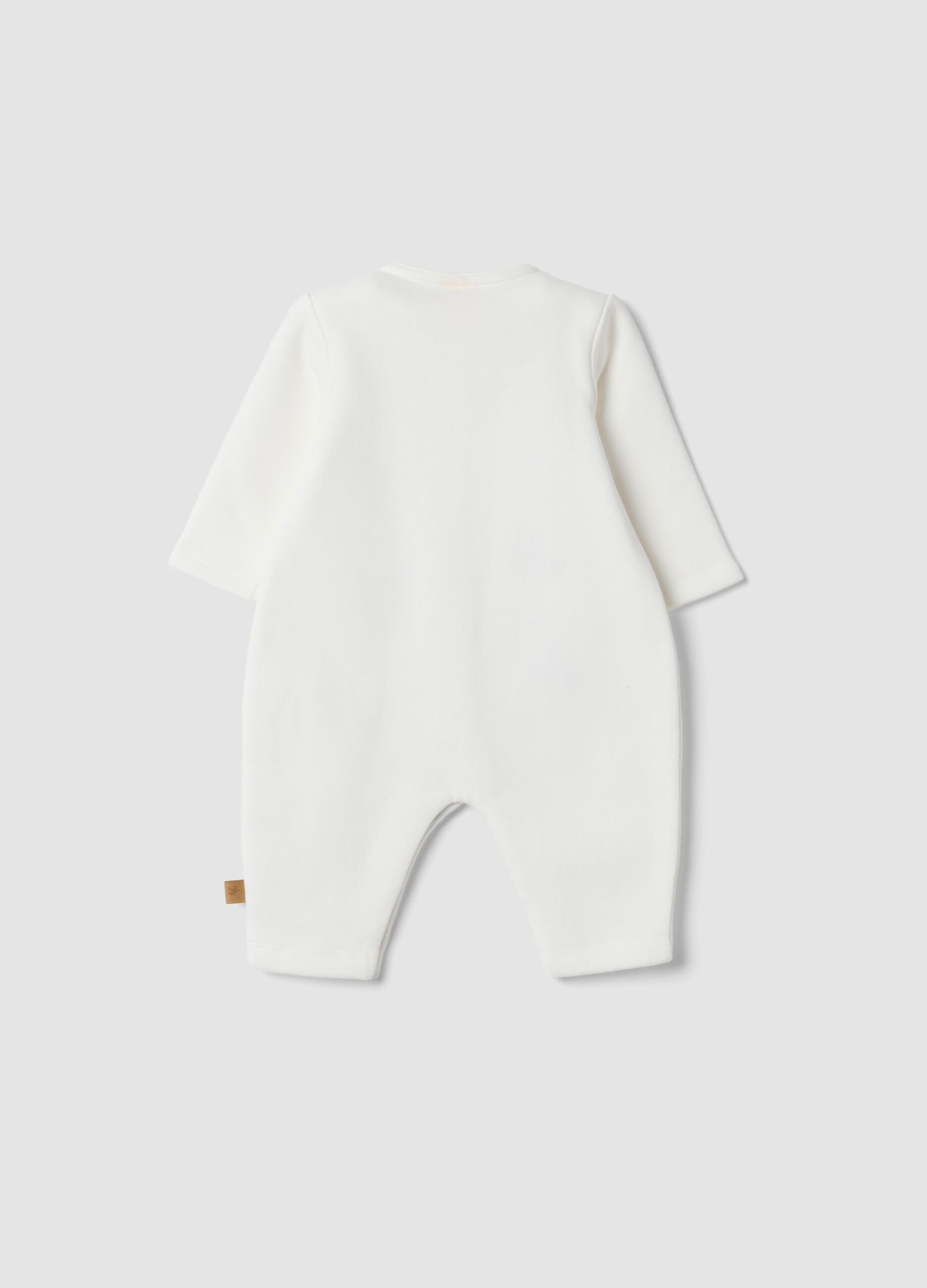 Off-white organic cotton sleepsuit with Winnie the Pooh print