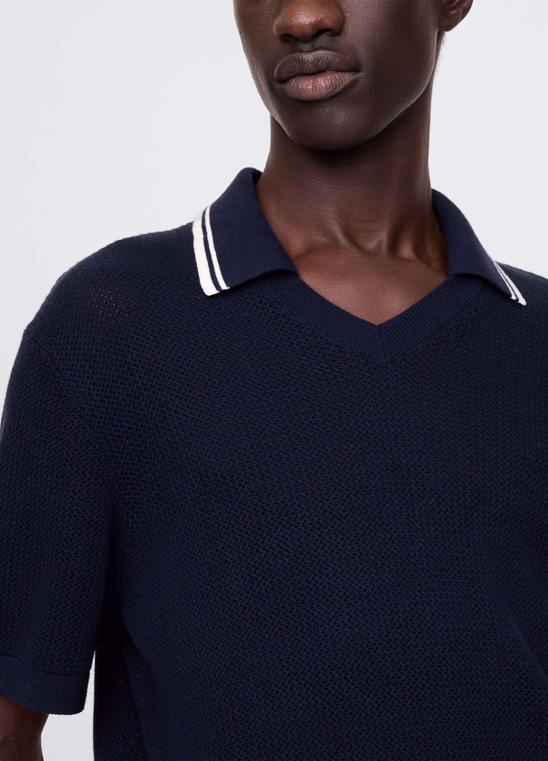 Polo traforata in cotone blu