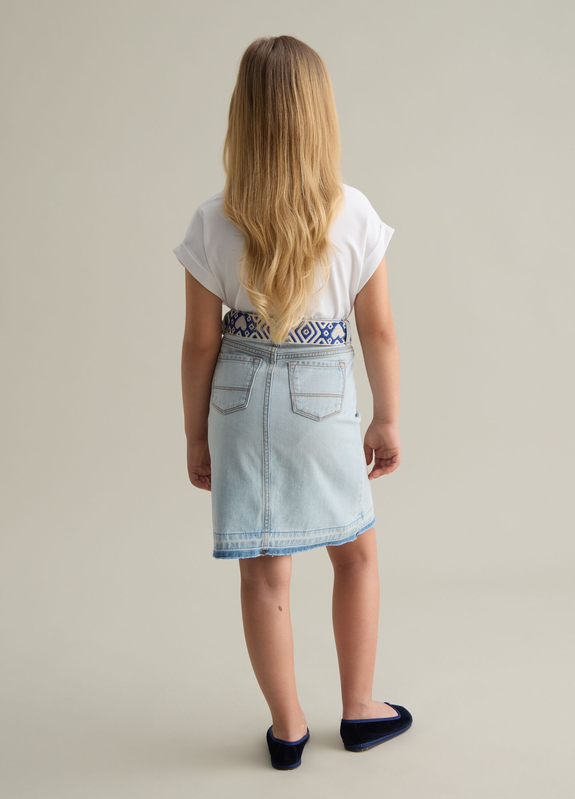 Denim skirt with ethnic belt in cord