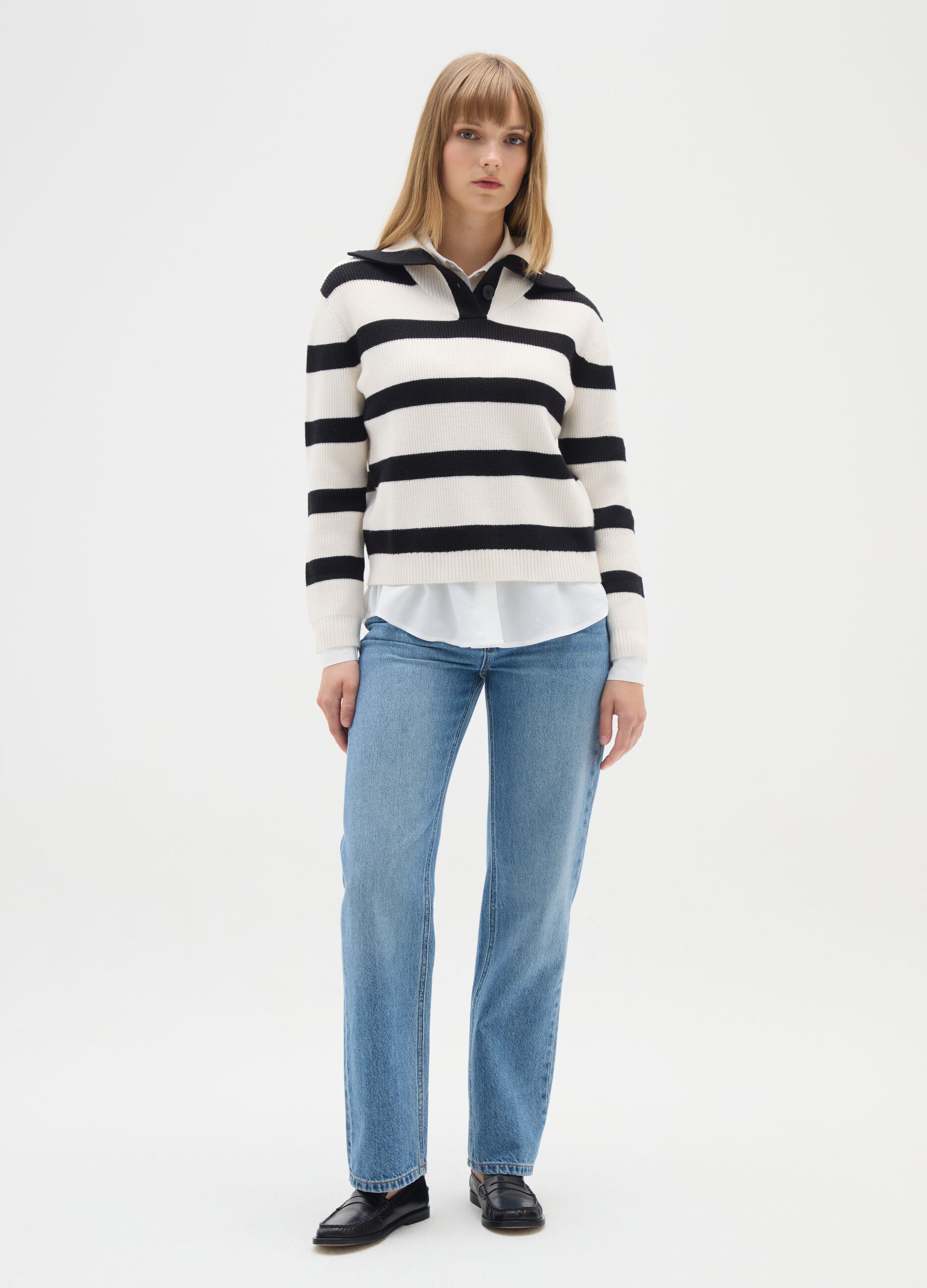 White jumper with black stripes and collar