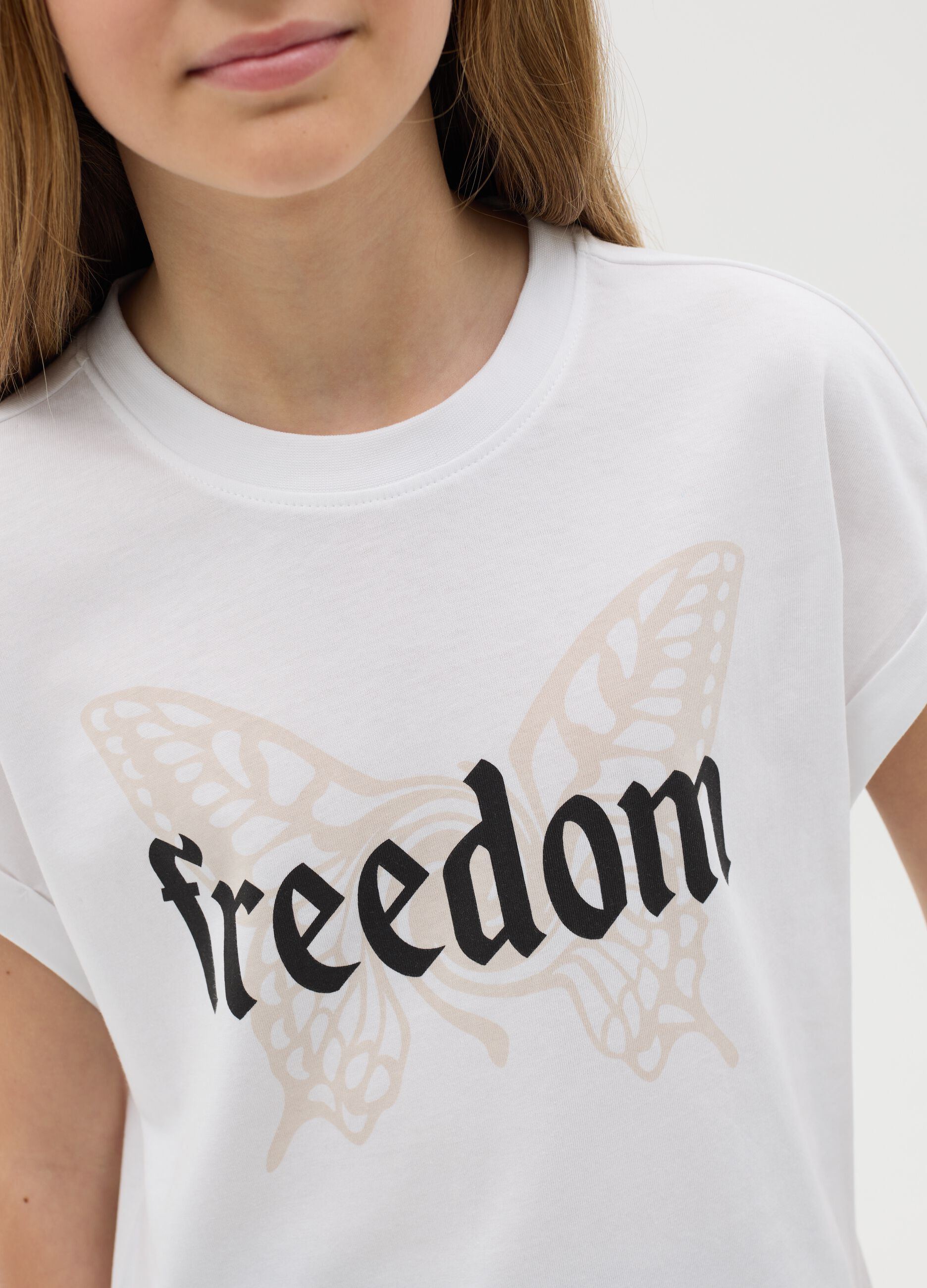 White T-shirt with butterfly print and Freedom text