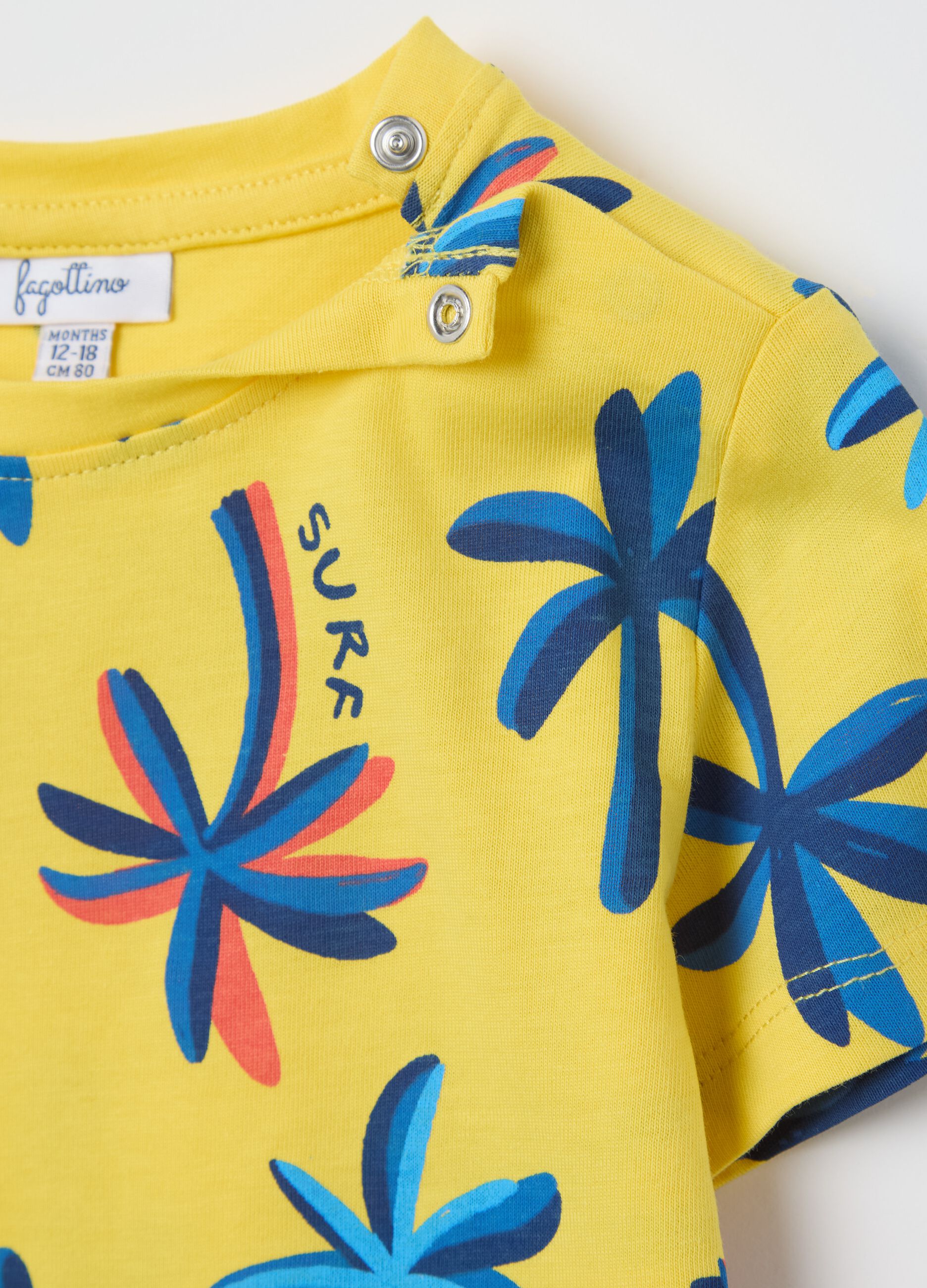 T-shirt gialla in cotone con stampa palme