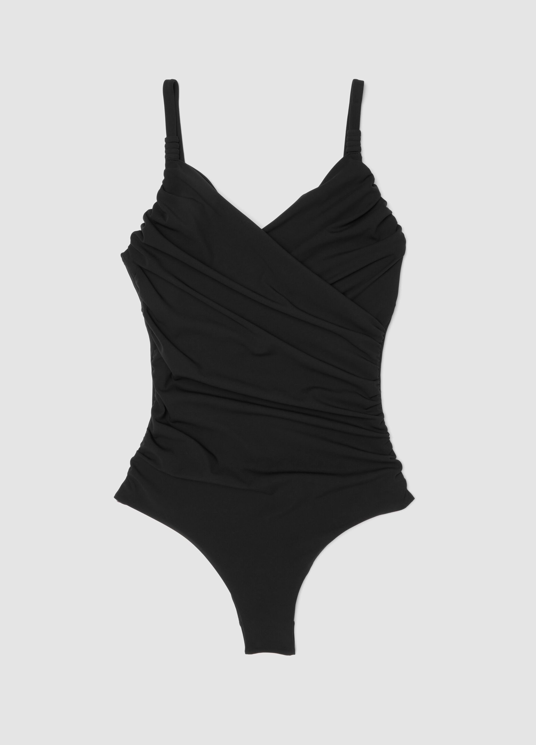 Black draped stretch swimsuit with shaping effect