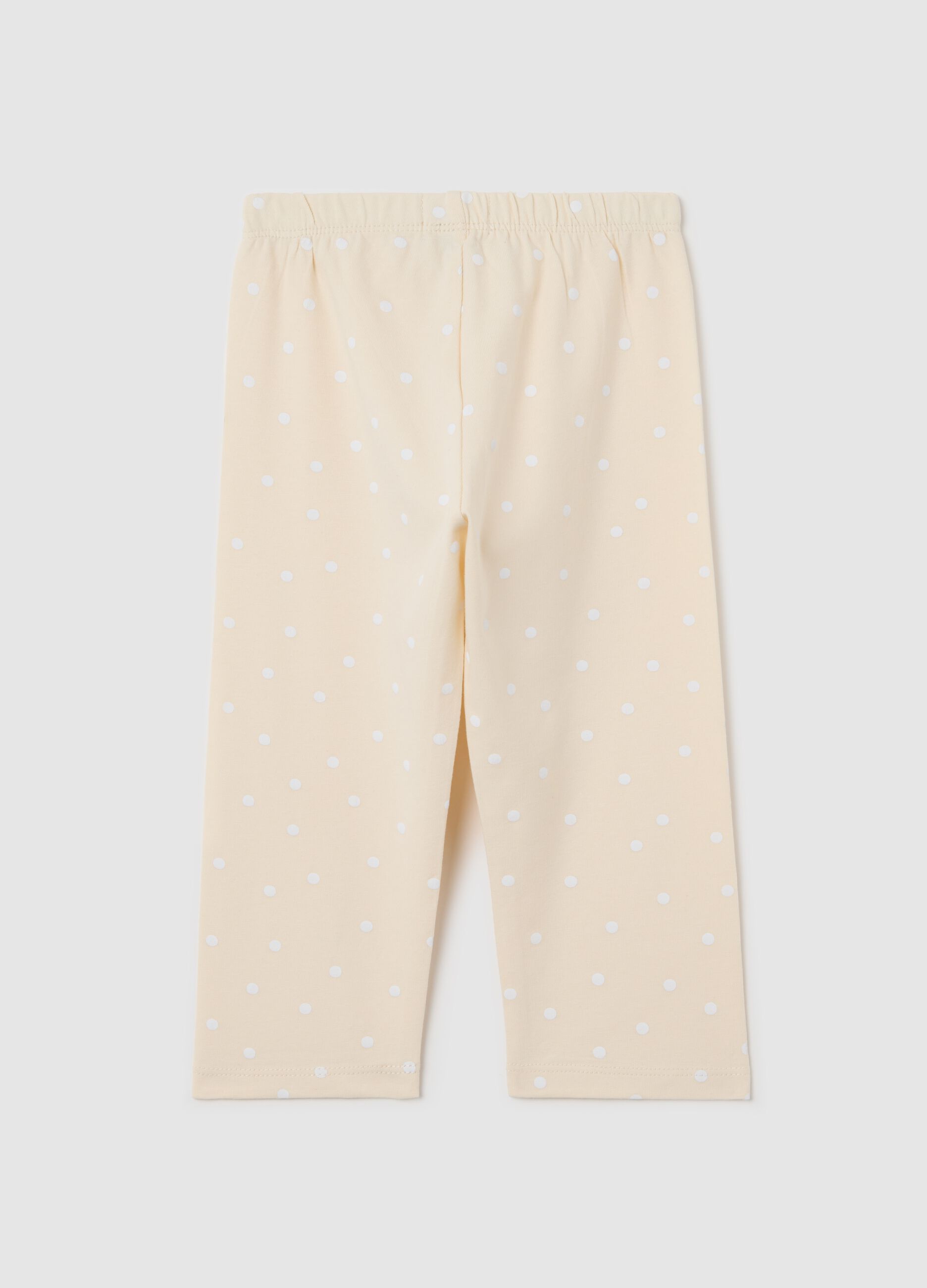 Beige three-quarter leggings with polka dot pattern