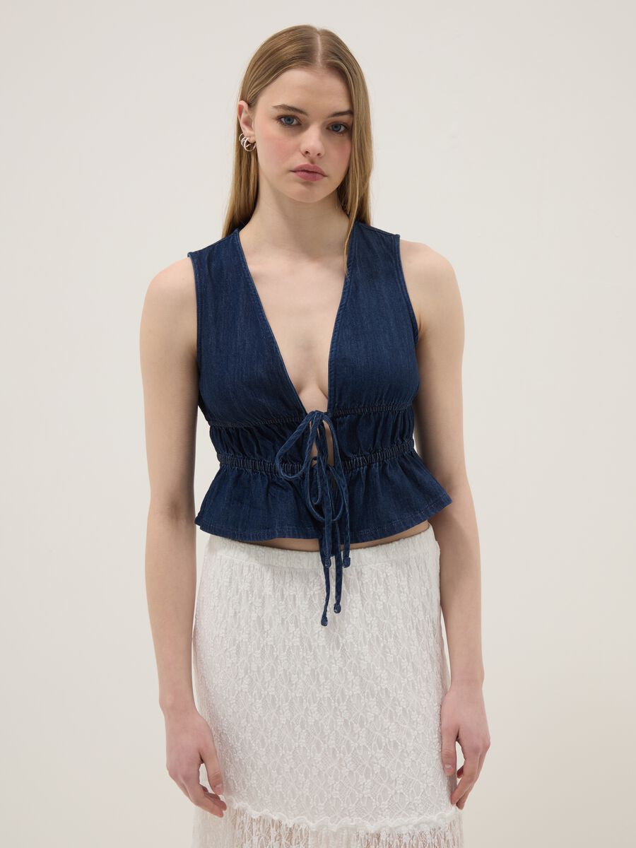 Blue sleeveless denim blouse in pure cotton, slim fit with tie fastening_1