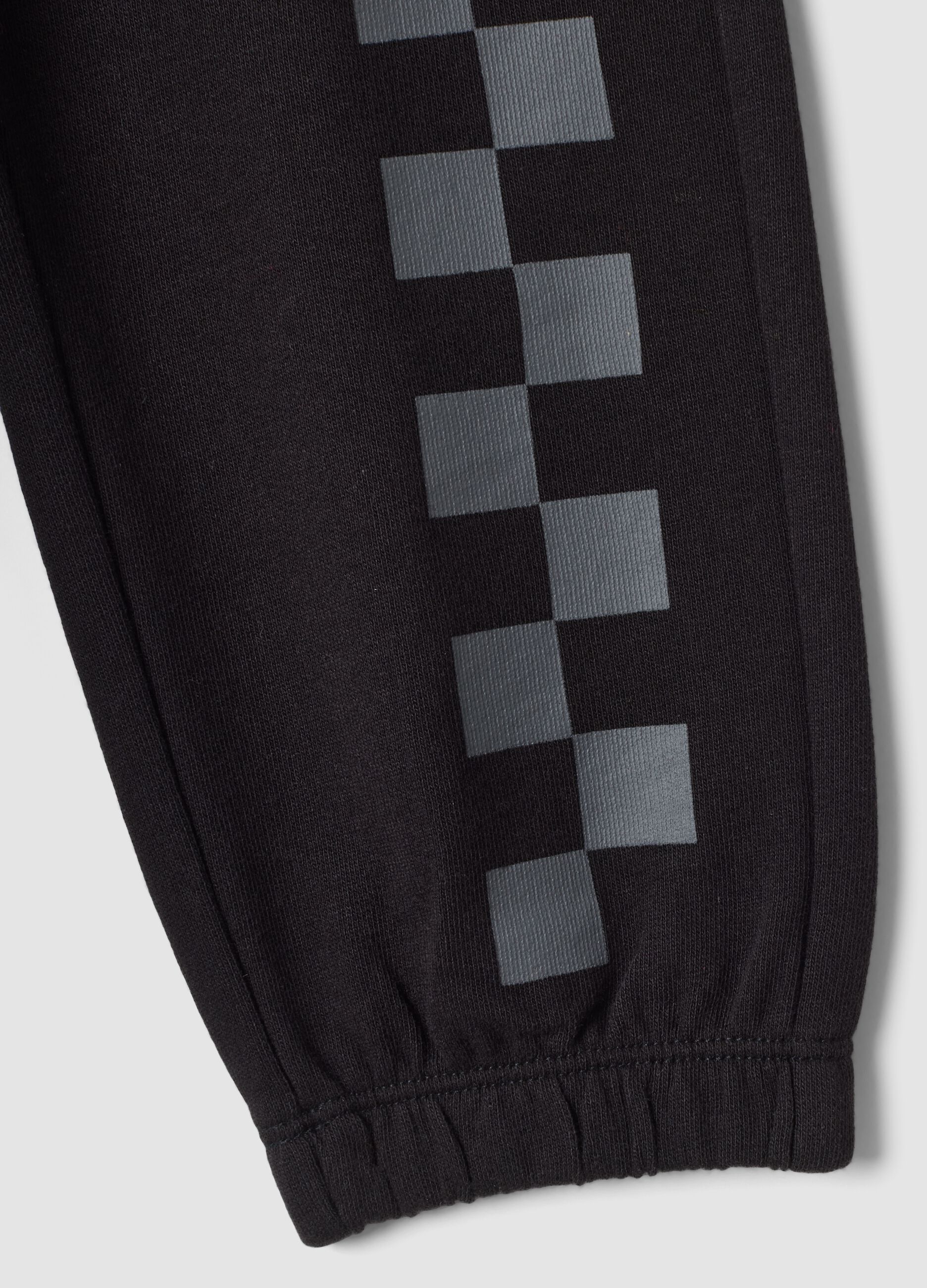 Pantaloni jogger neri in puro cotone con stampa a scacchi