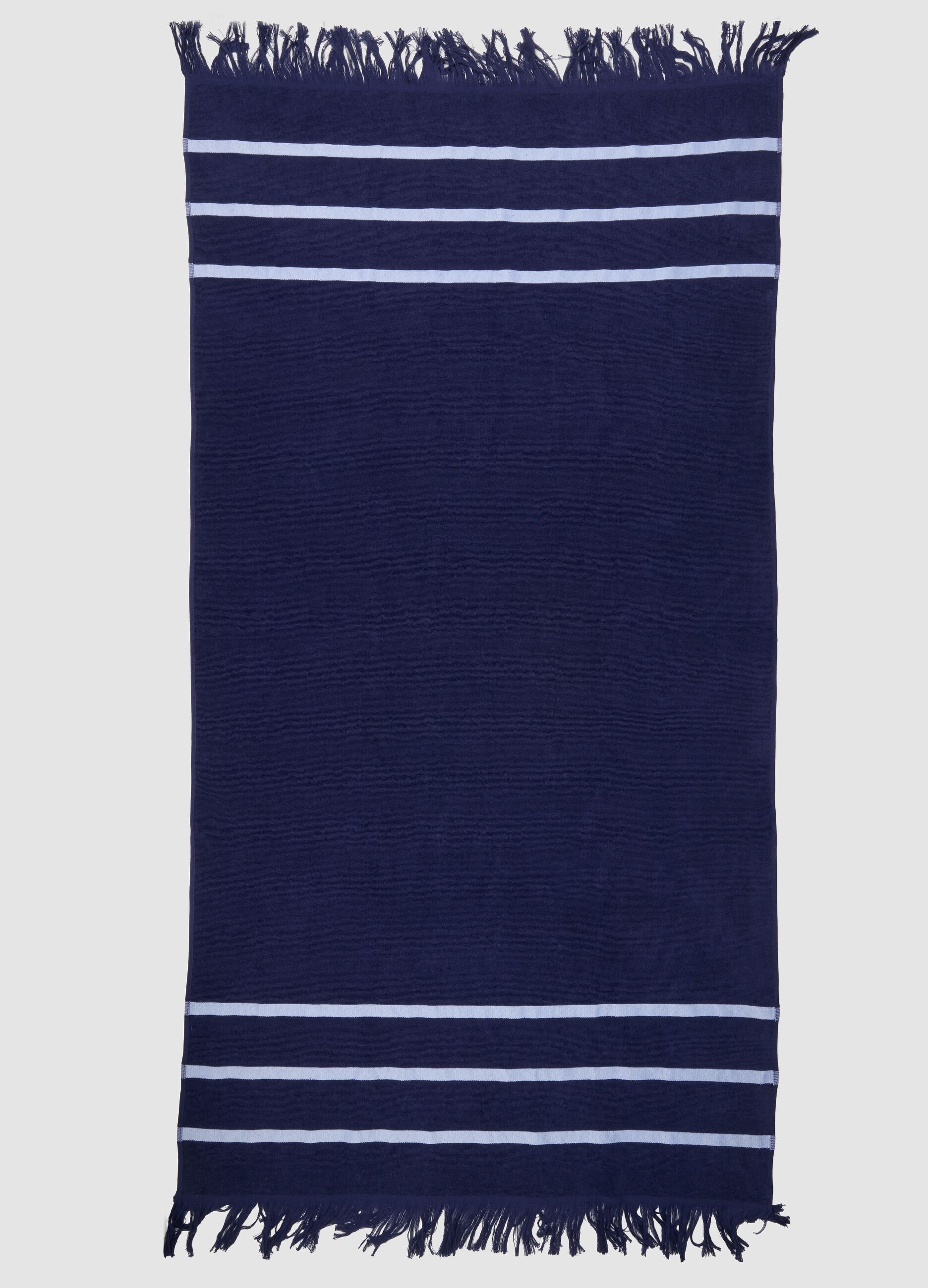 Telo mare blu in misto cotone con frange