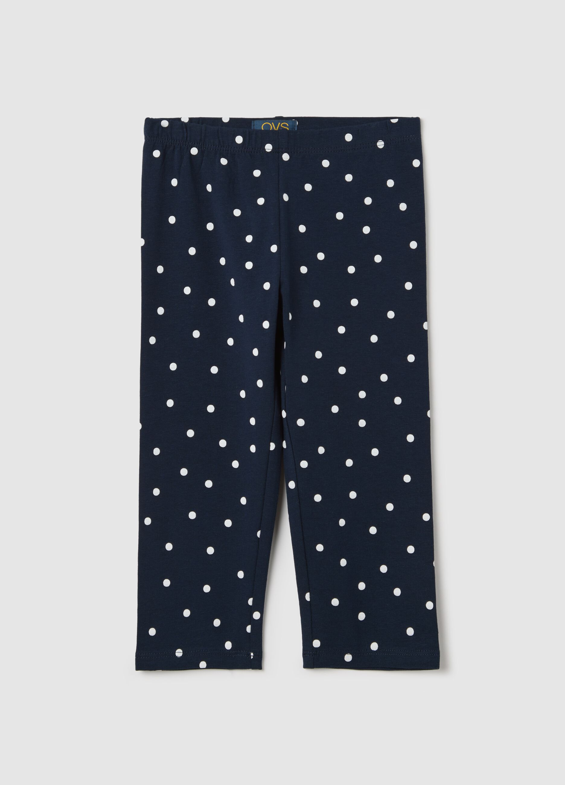 Blue three-quarter leggings with polka dot pattern
