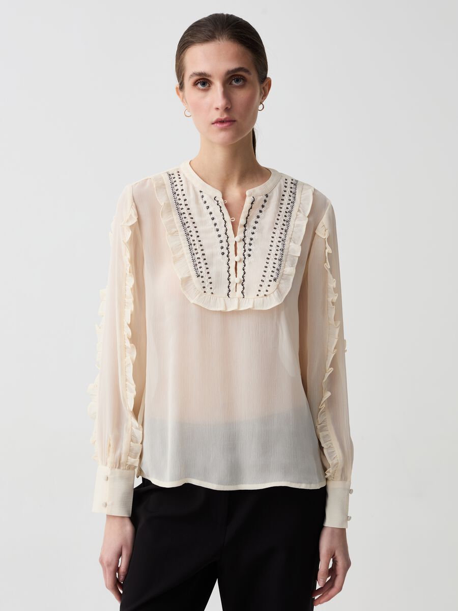 Crêpe blouse with embroidery and frills_1