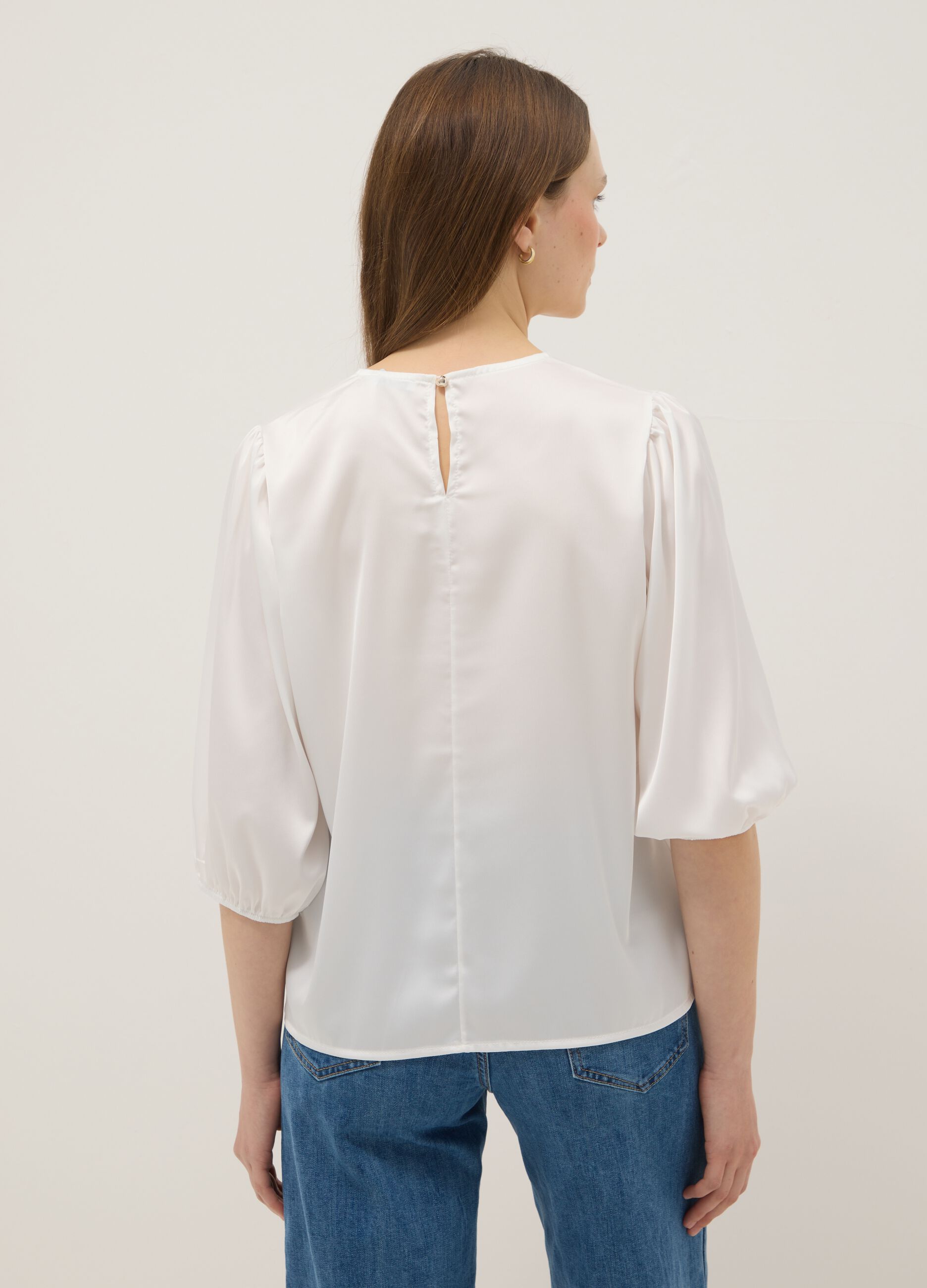 White long-sleeve top with wide sleeves